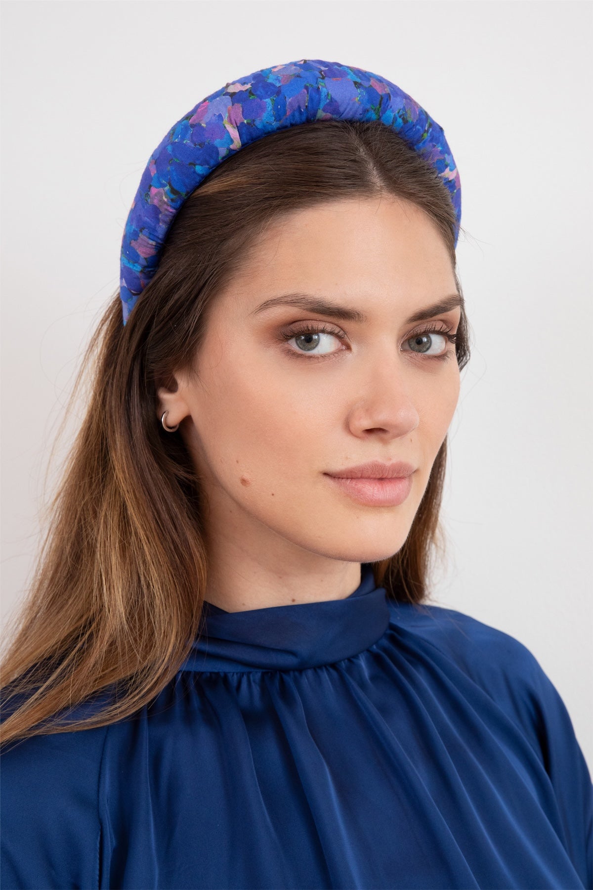 model wearing stylish sustainable silk bamboo padded headband hand stitched in the UK