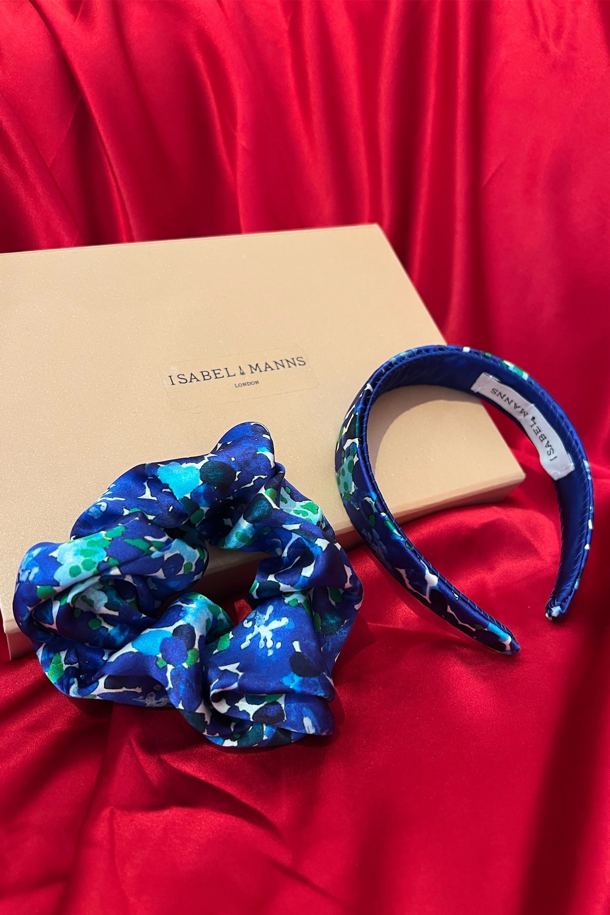 a blue printed headband and scrunchie in a gift box