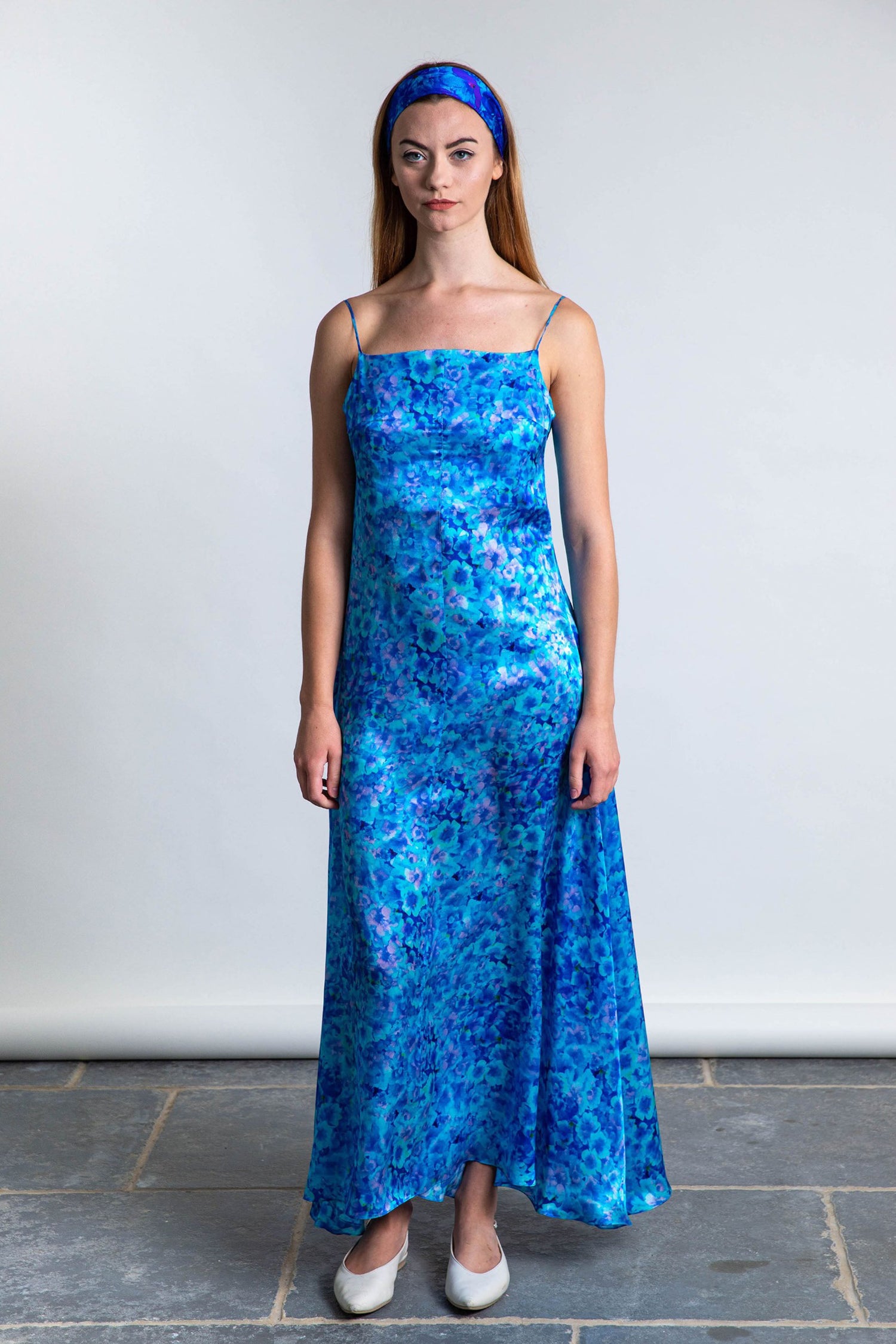 long slip dress in silk satin turquoise print worn by model