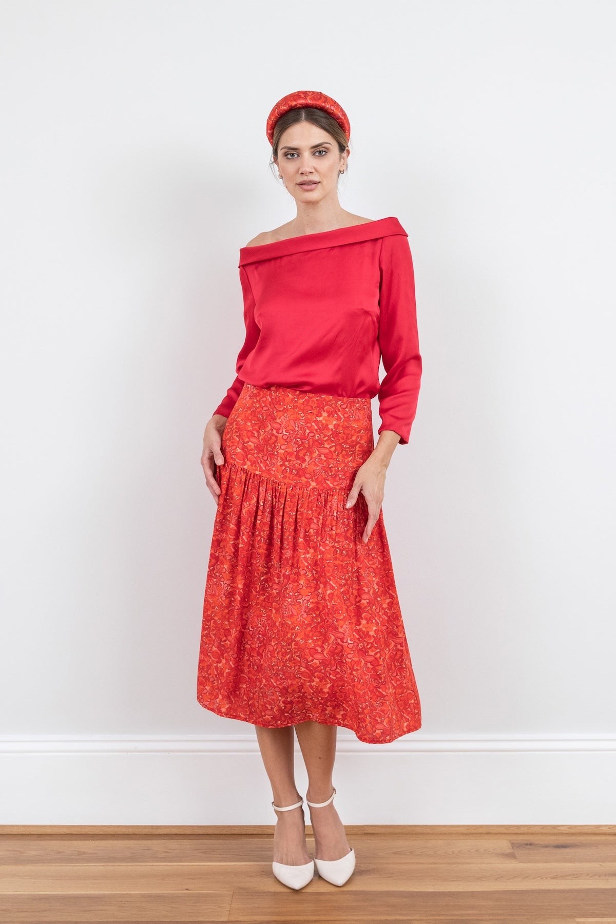 Reversible boat neckline top with ¾ sleeves in raspberry pink, worn with matching Lola Skirt Miami passion and padded headband.