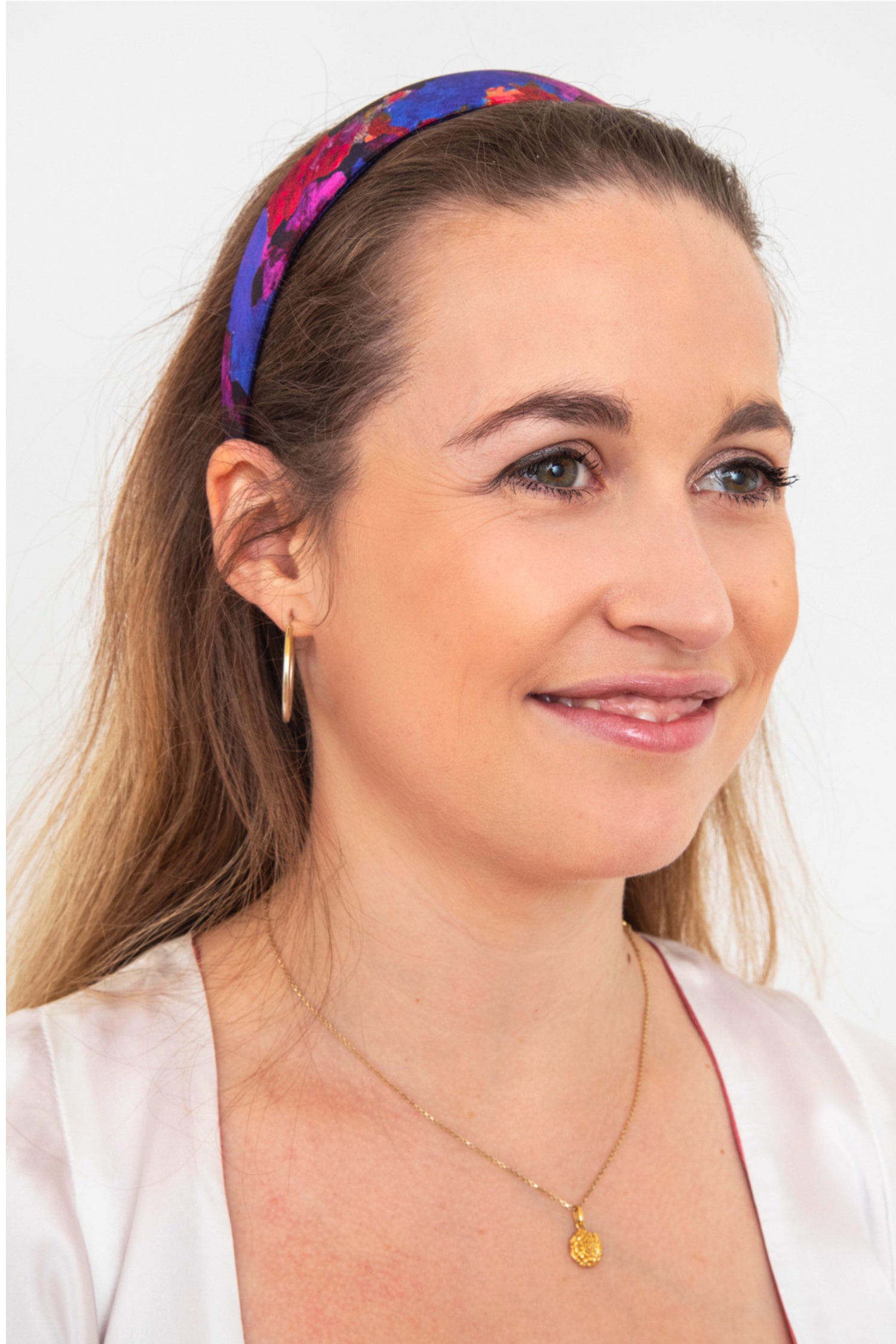 a blue and purple printed silk headband that is sustainably made