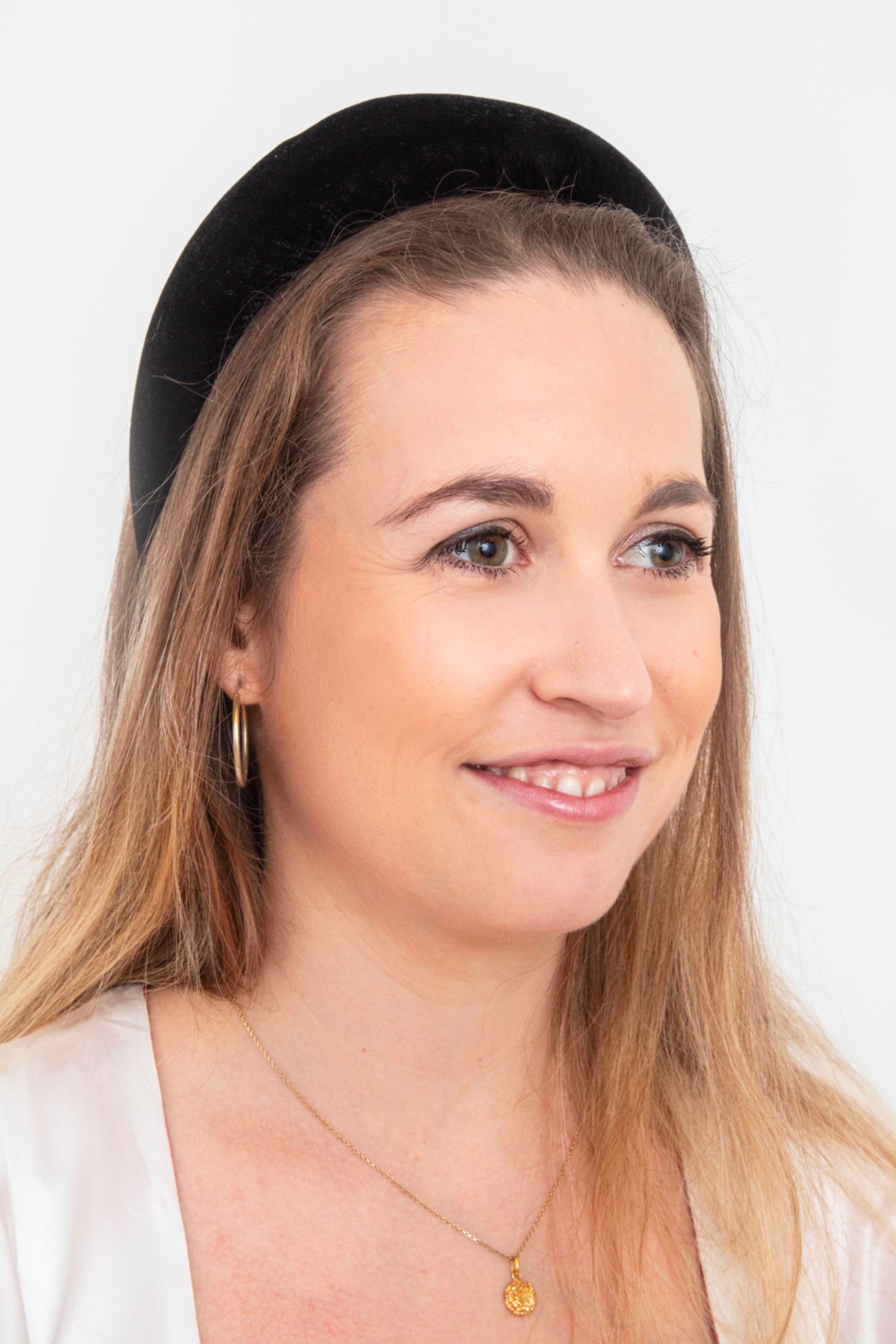 a timeless and elegant black velvet padded headband for a stylish look