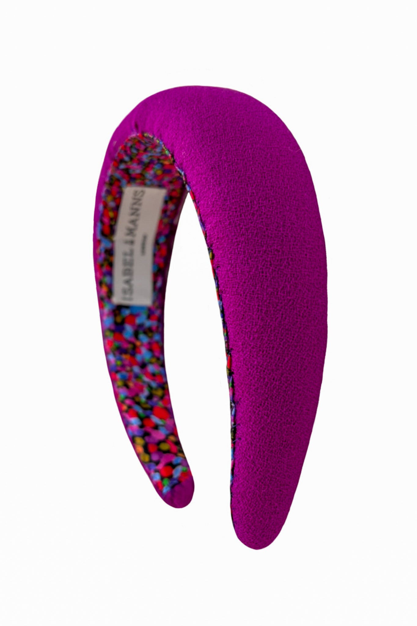 a megenta coloured padded headband made in the UK