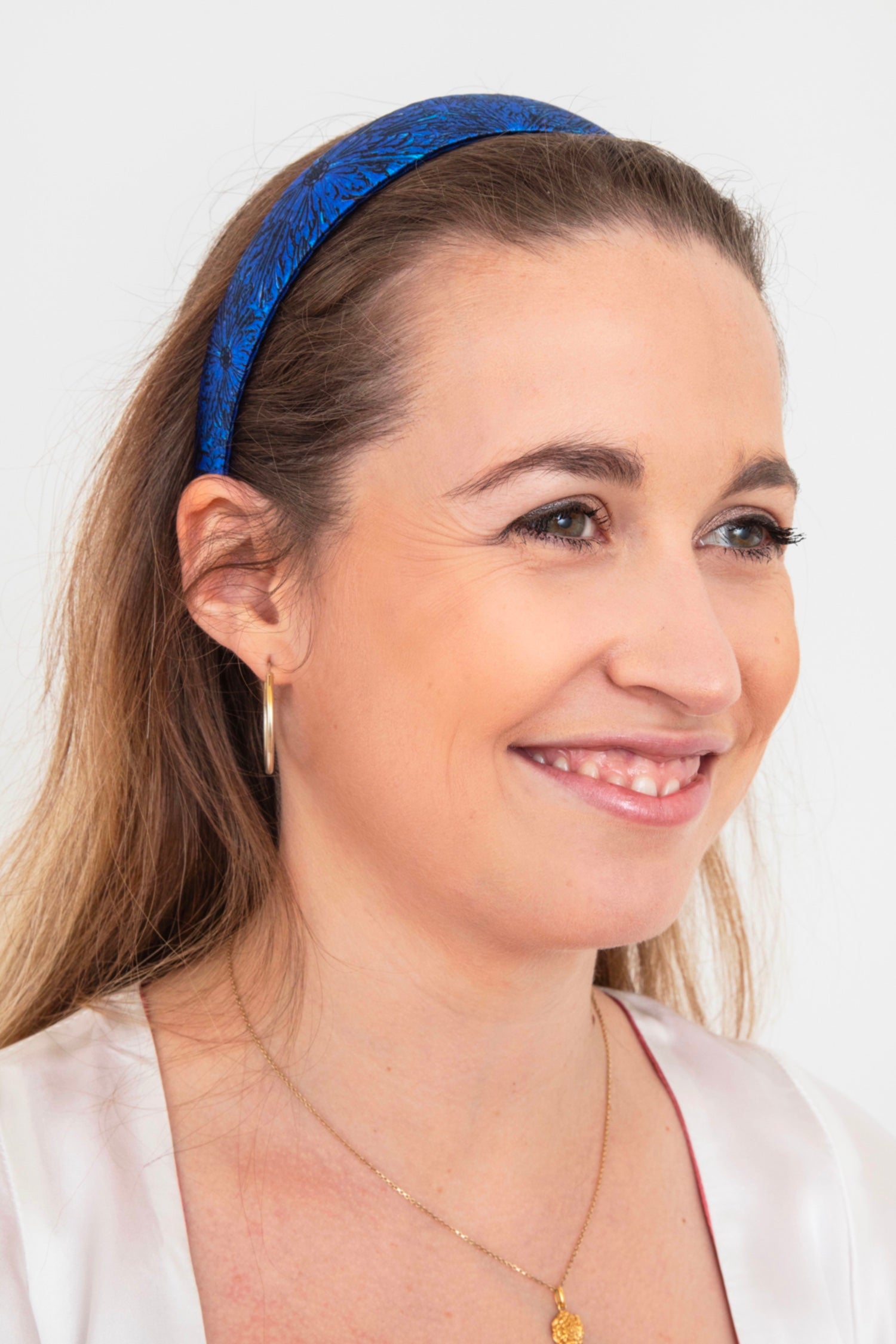 Midnight blue silk satin headband worn by a model that is elegant and timeless