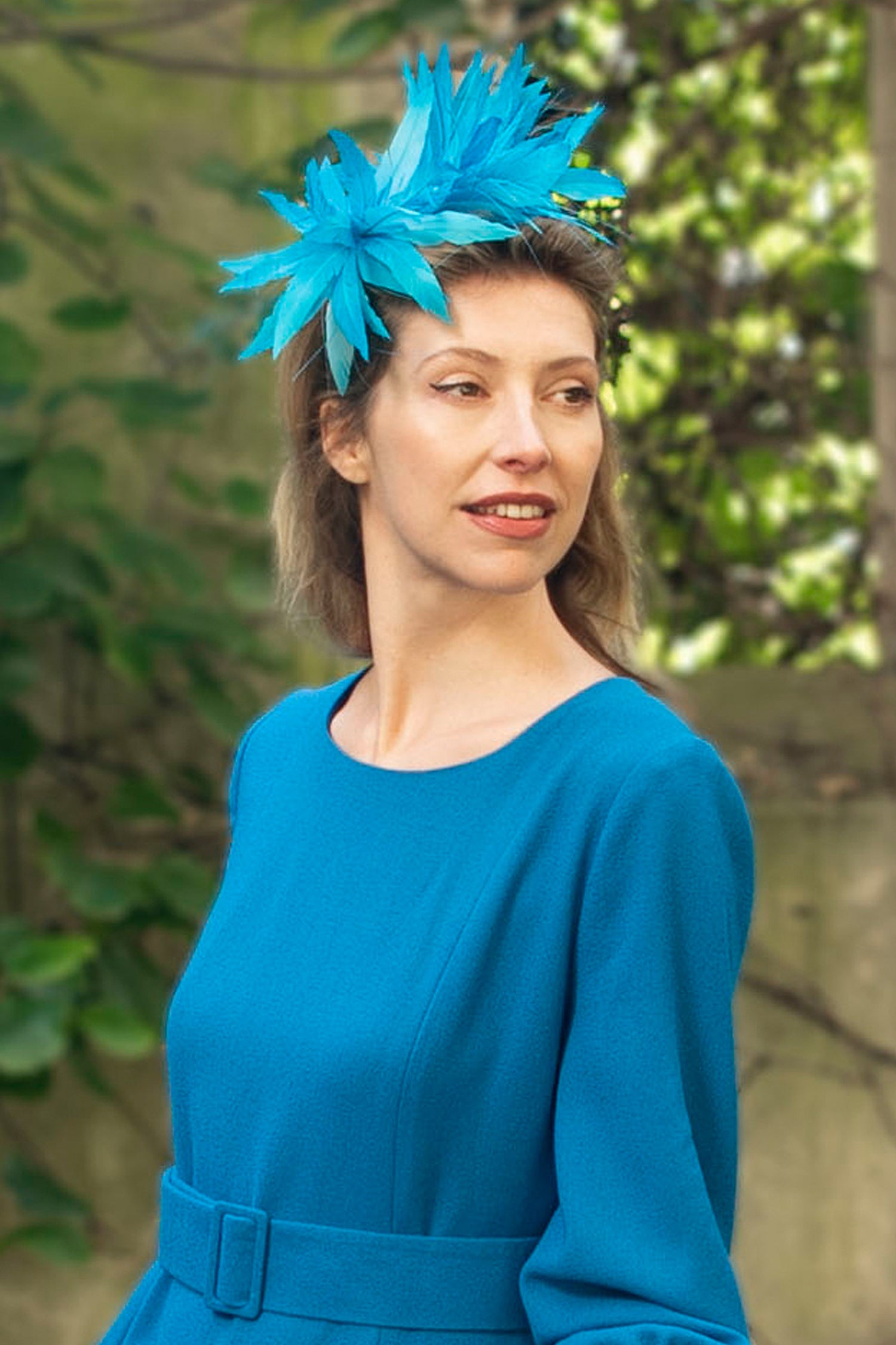 Teal feather thin band fascinator