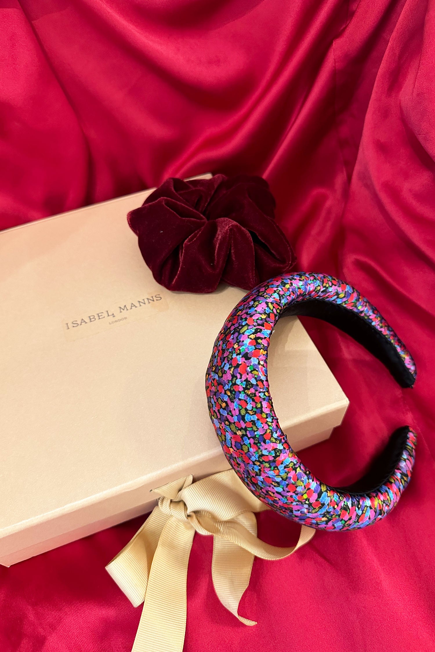 Pink and purple dotted silk satin padded headband with burgundy velvet scrunchie and medium pink gift box bow tied ribbon.