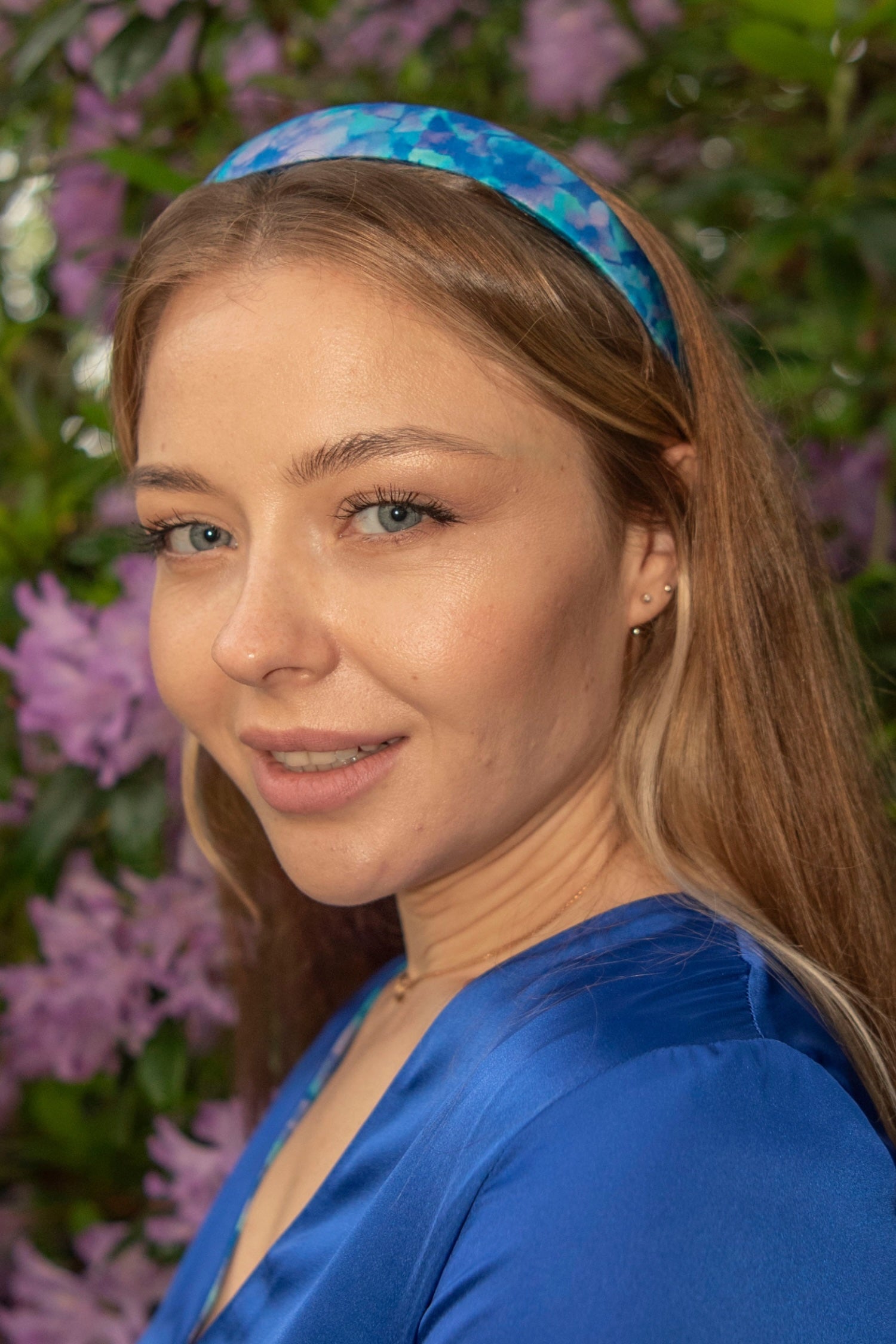 model wearing elegant turquoise floral silk satin headband