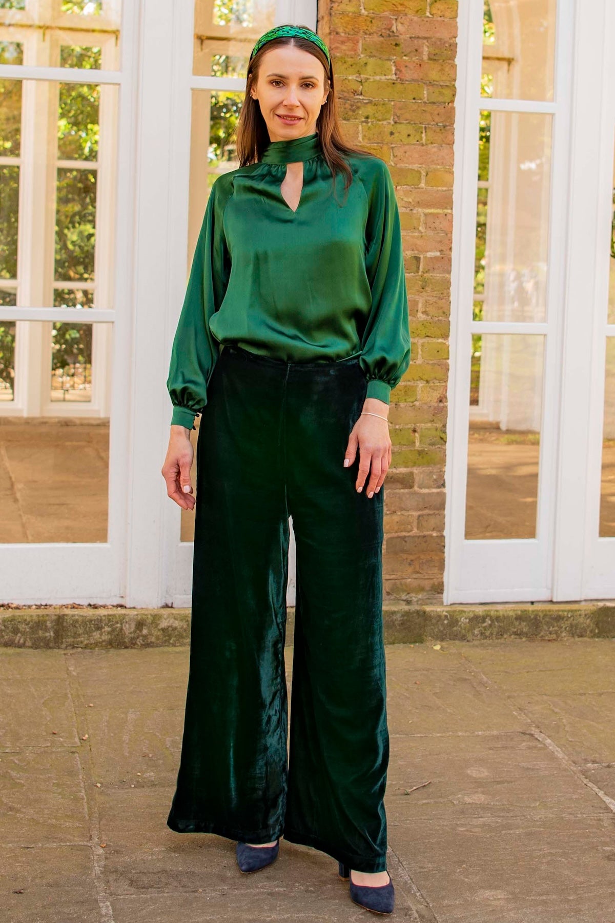 Forest green silk long sleeve halter neck top and velvet palazzo pants front view