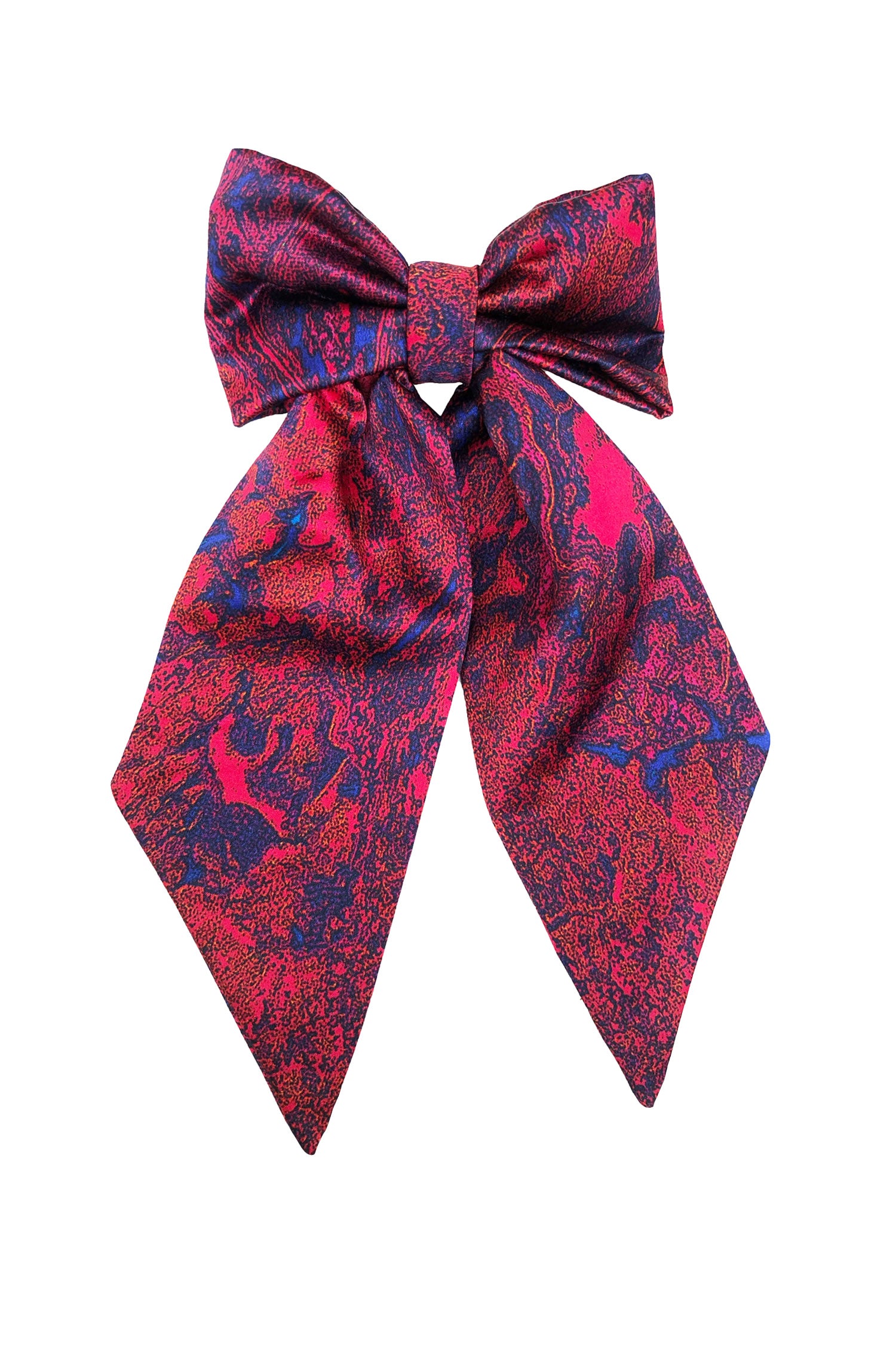 An Isabel Manns red marble print silk satin bow with ribbon styling and silver hair clip.