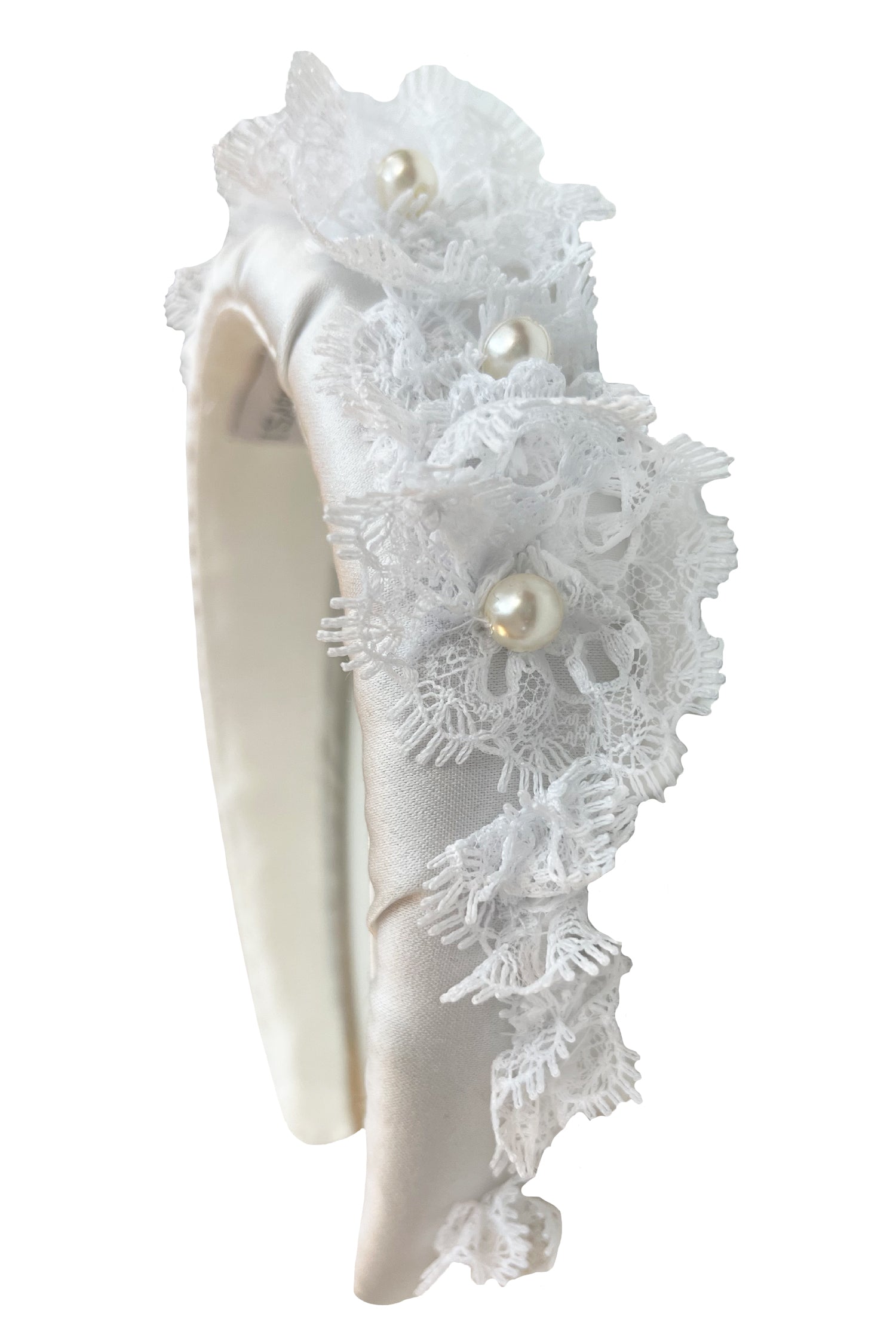 a white padded headband with stunning intricate detail in the lace trim and pearls handmade in London