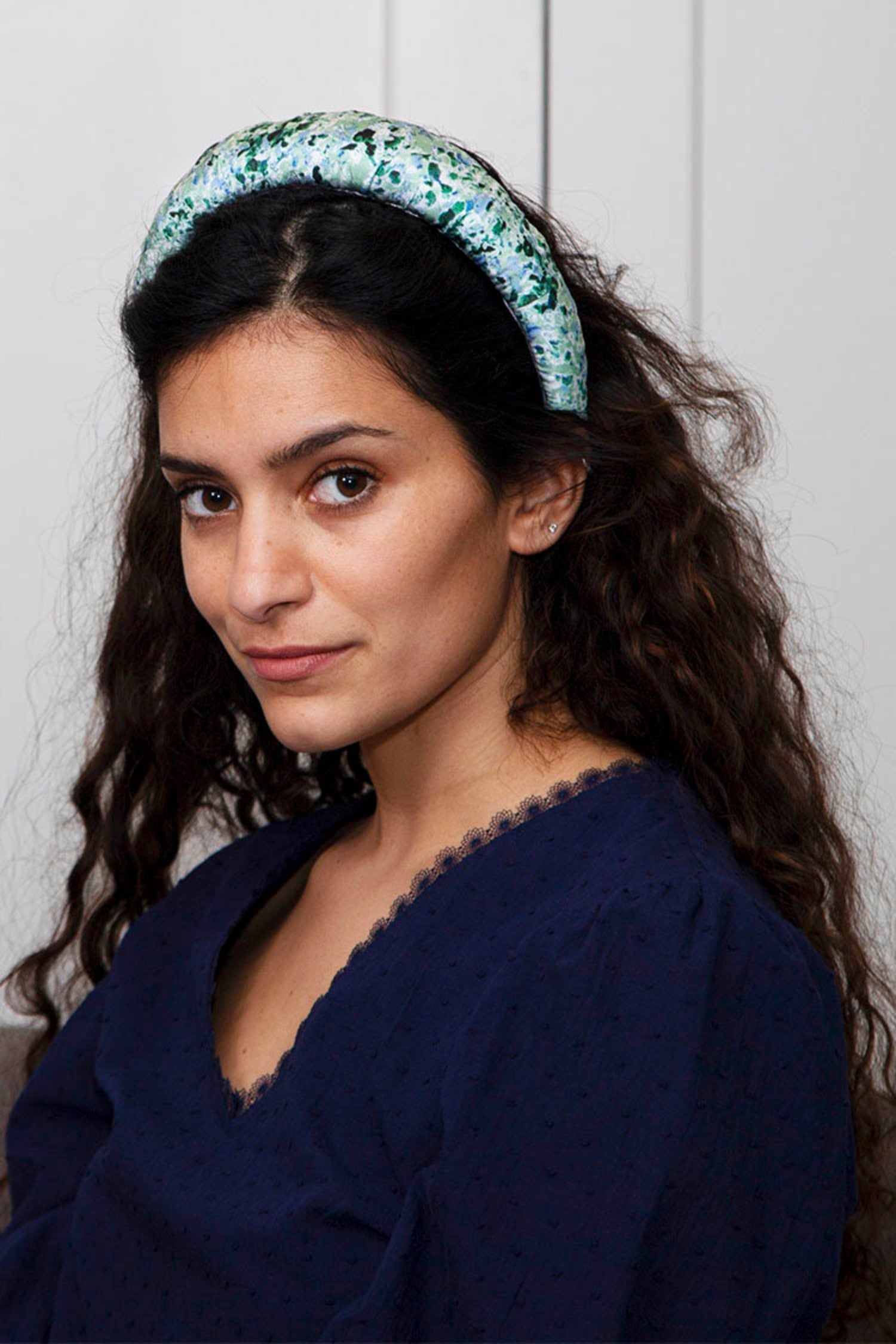 a pale green padded headband
