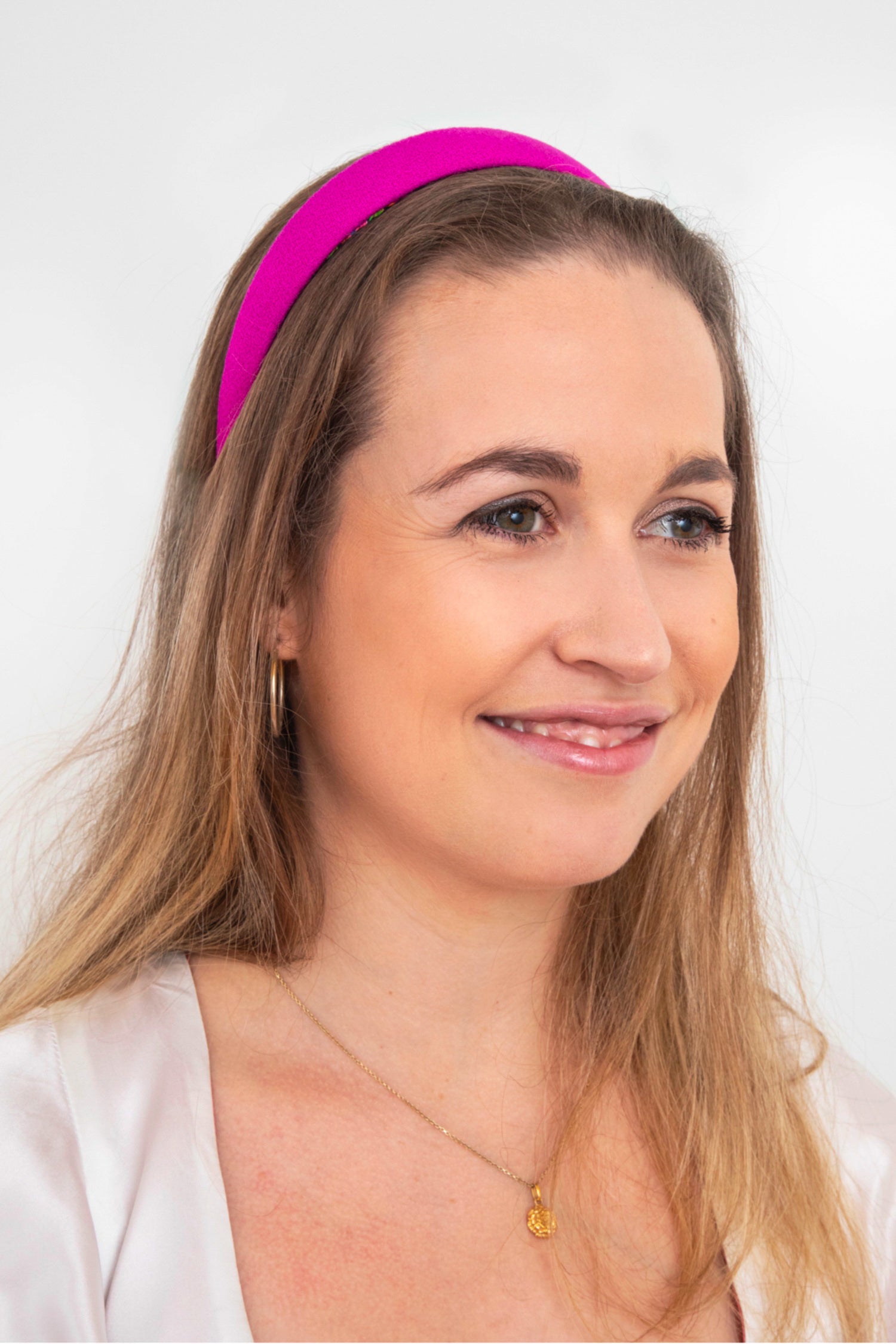 vibrant magenta wool crepe headband on a model