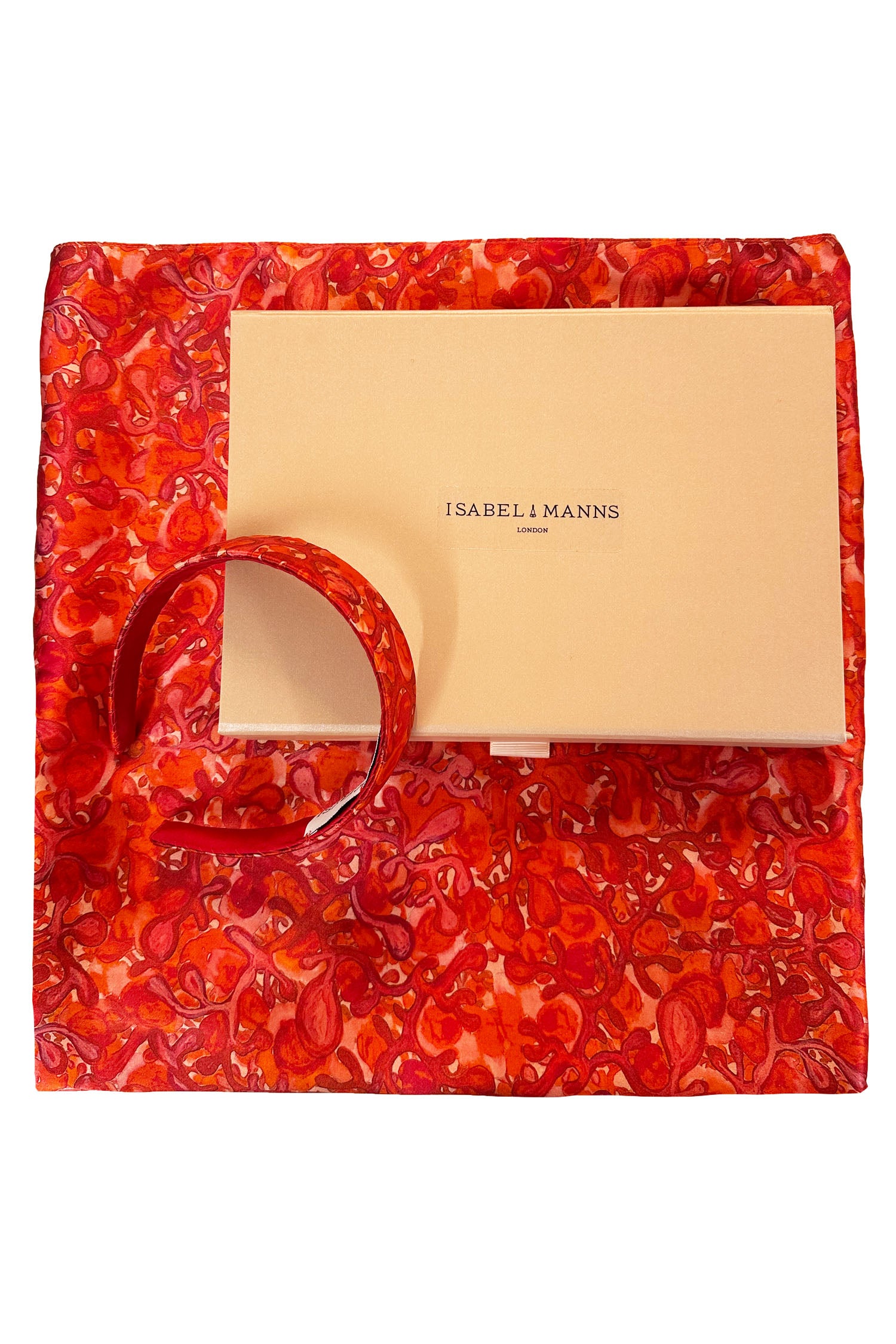 Long double-sided silk satin scarf in swirling red and pink print, with matching headband and large pink gift box bow tied ribbon.