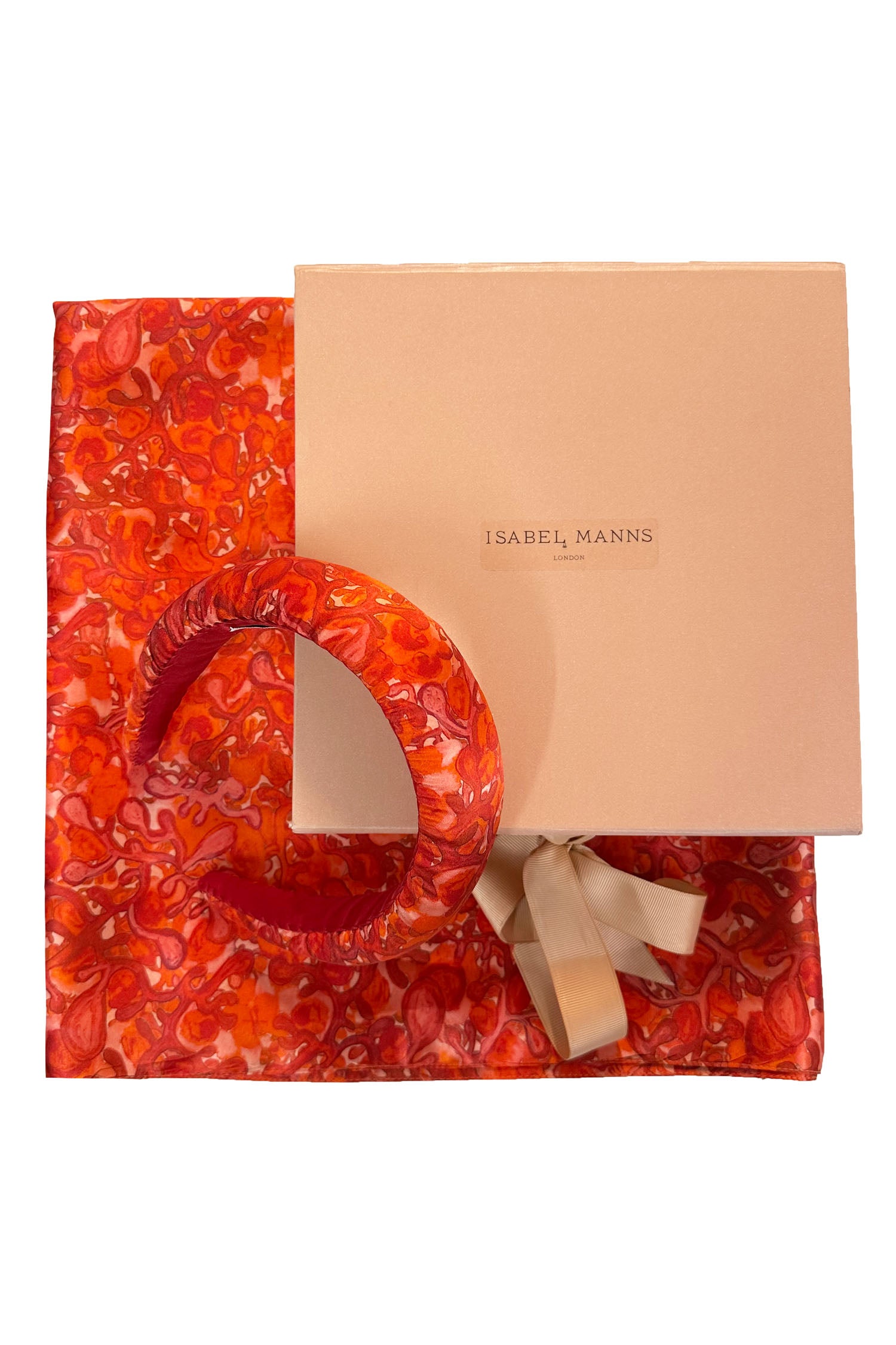 Long double-sided silk satin scarf in swirling red and pink print, with matching padded headband and large pink gift box bow tied ribbon.