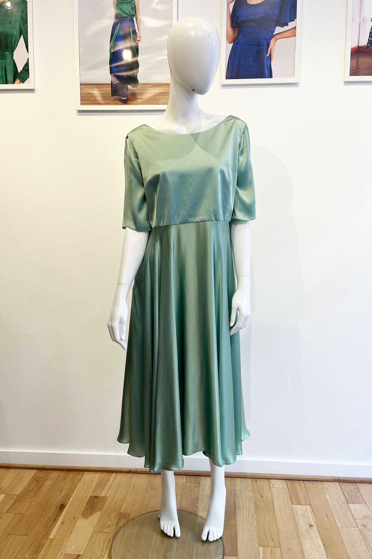 A unique bespoke dusty pale green 100% silk satin A-line dress with elbow length sleeves and midi length