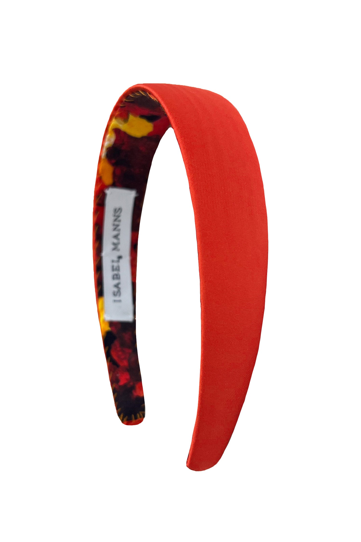 a vibrant orange plain satin headband that is bold and elegant