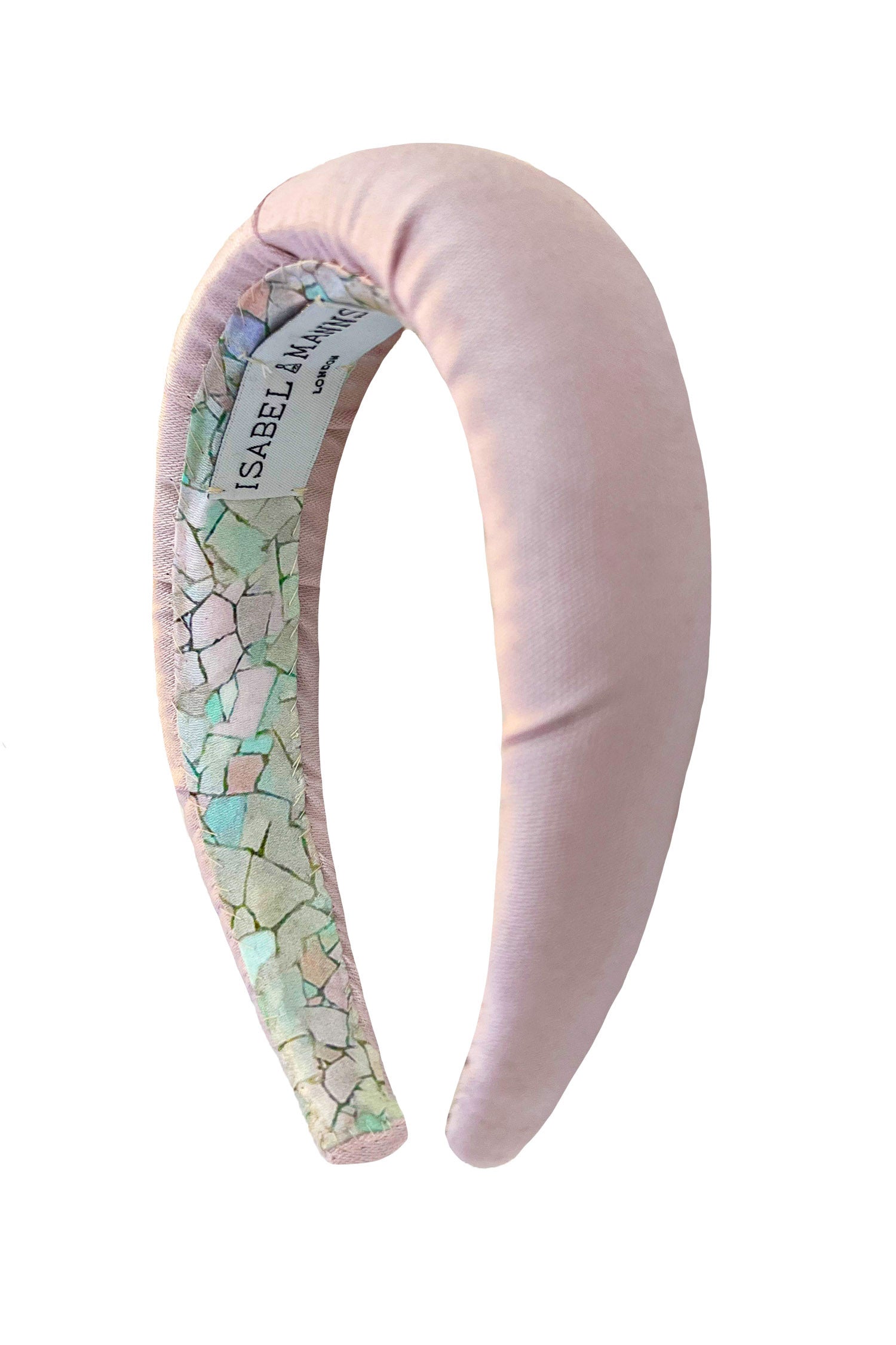 A headband in a pretty pale pink colour that will complete your outfit.