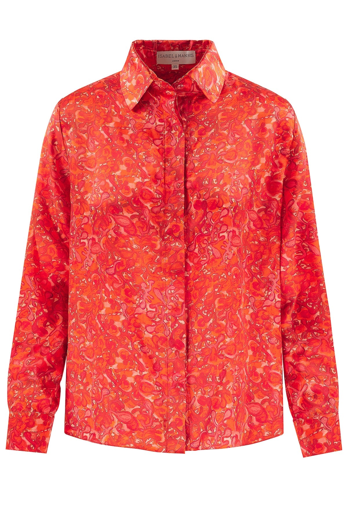 a bright red and pink silk satin printed shirt showing swirling patterns worn by a model with a matching alice band and white jeans