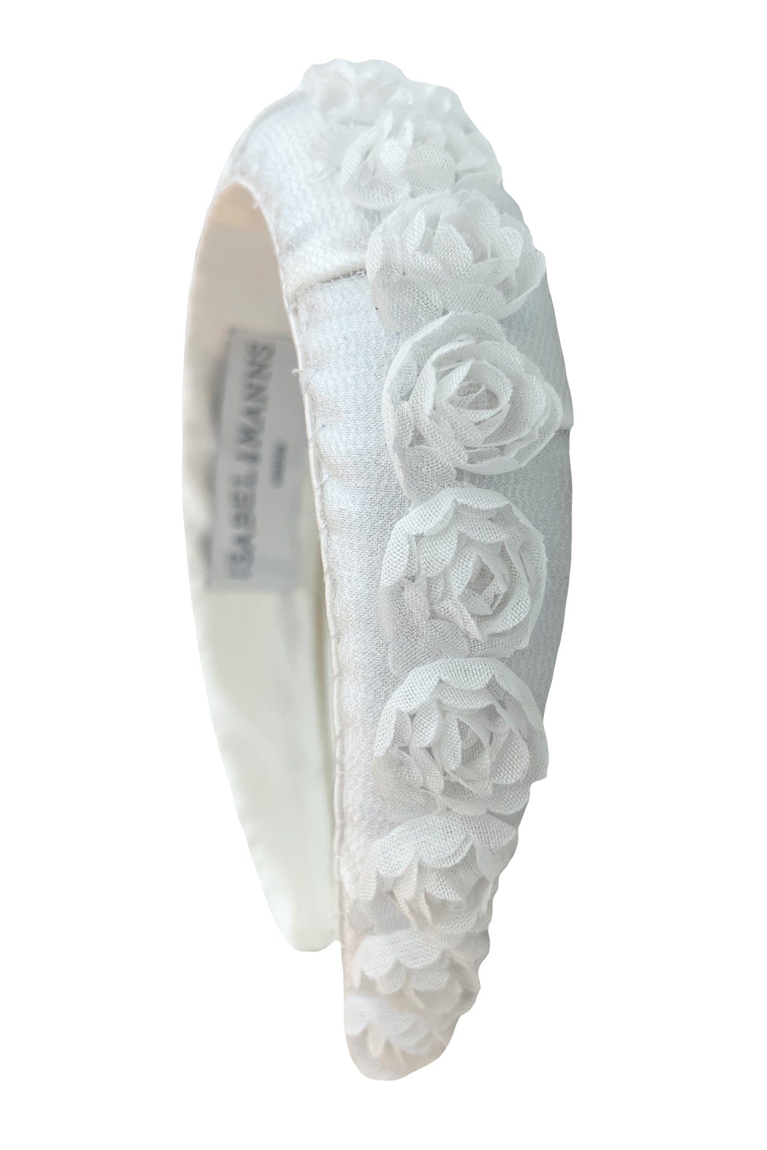white padded headband with rose trim detail hand stitched to the headband in London