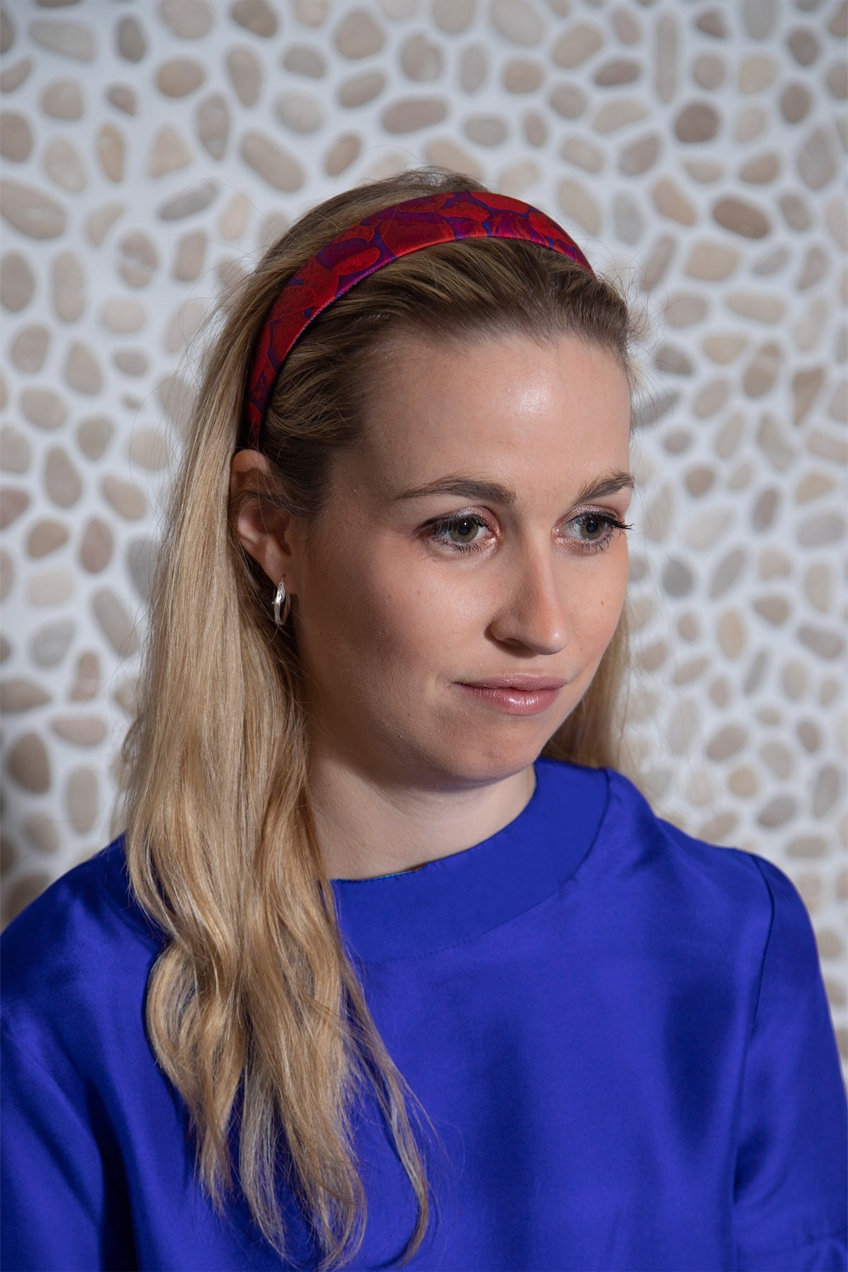 a small headband in a red printed silk