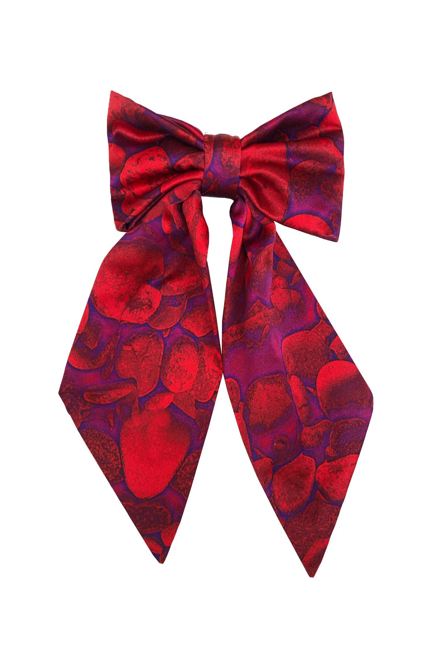 An Isabel Manns vibrant red print silk satin bow with ribbon styling and silver hair clip.