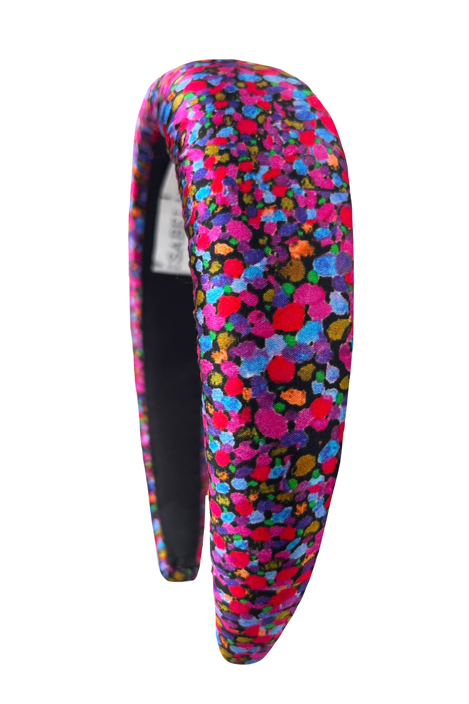 A vibrant dotted purple and pink printed padded headband that is chic