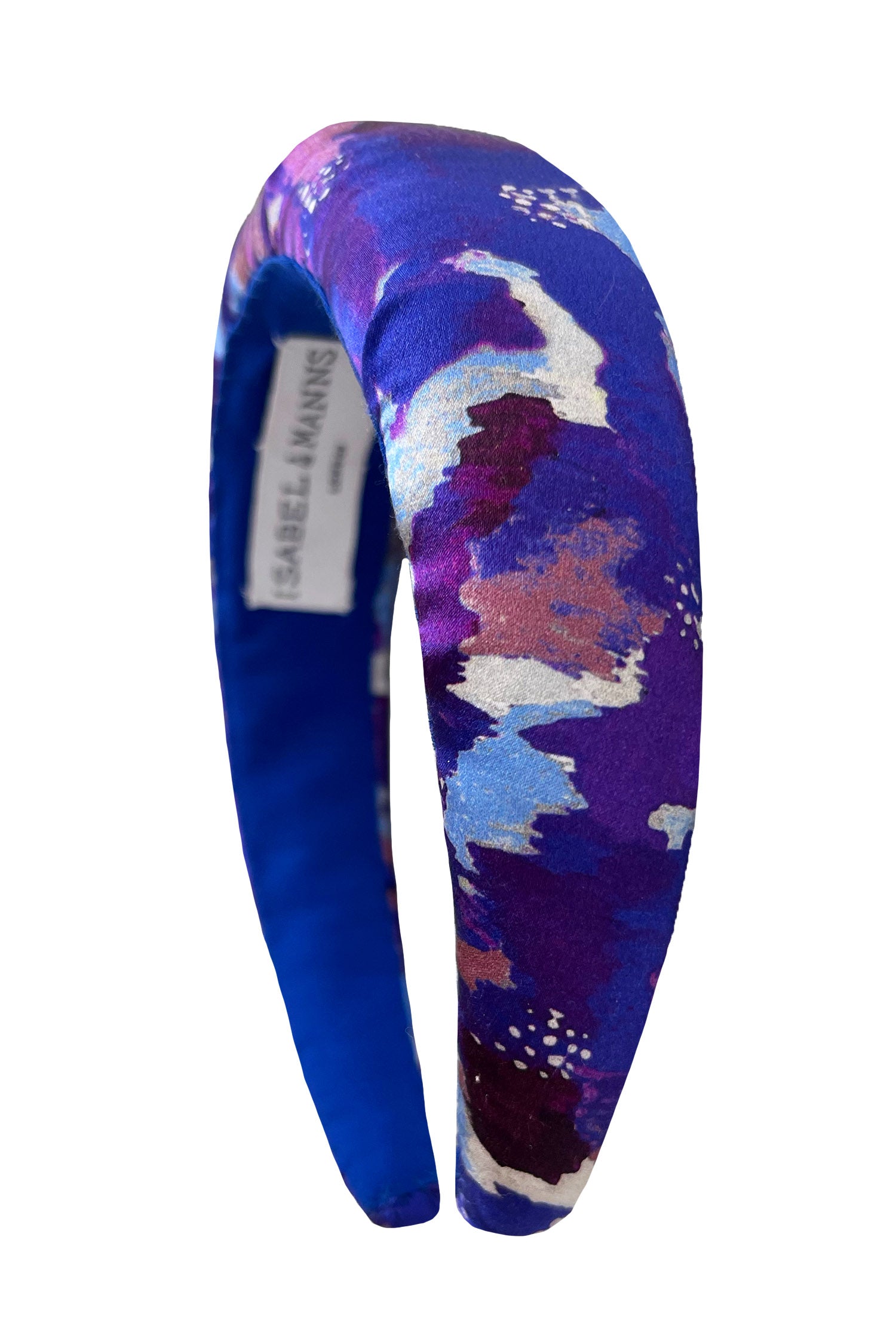 a silk padded headband comprising of a patchwork print made of purple shades