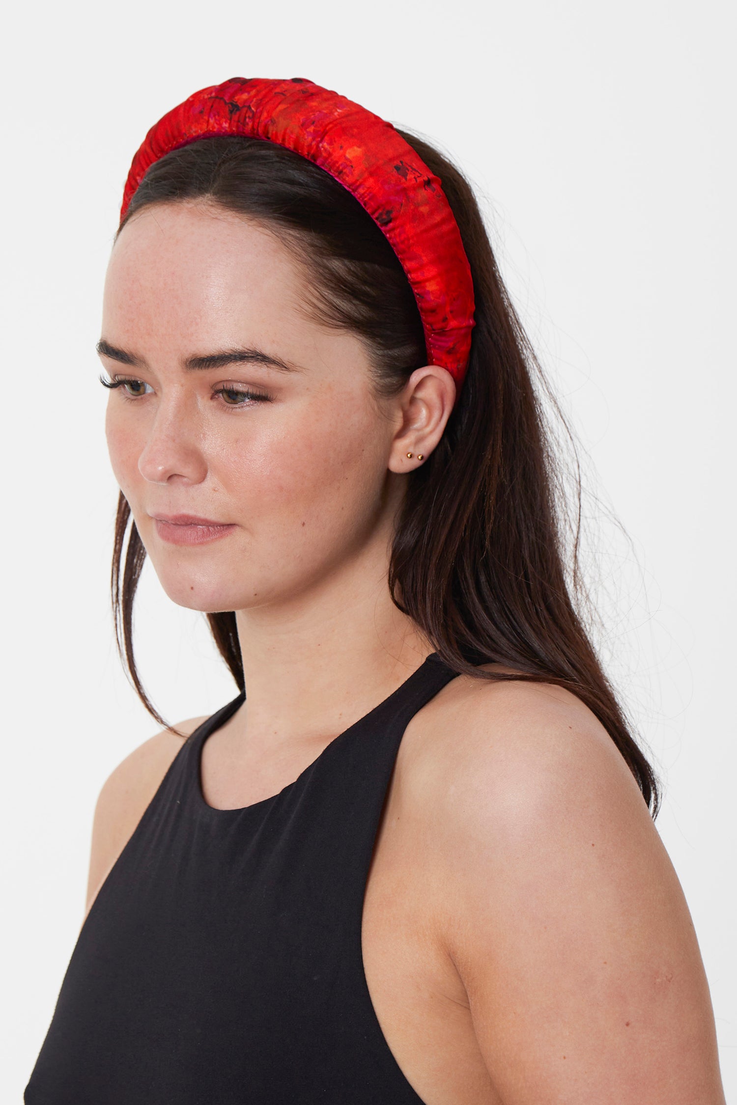a vivid red and pink subtle printed satin padded headband