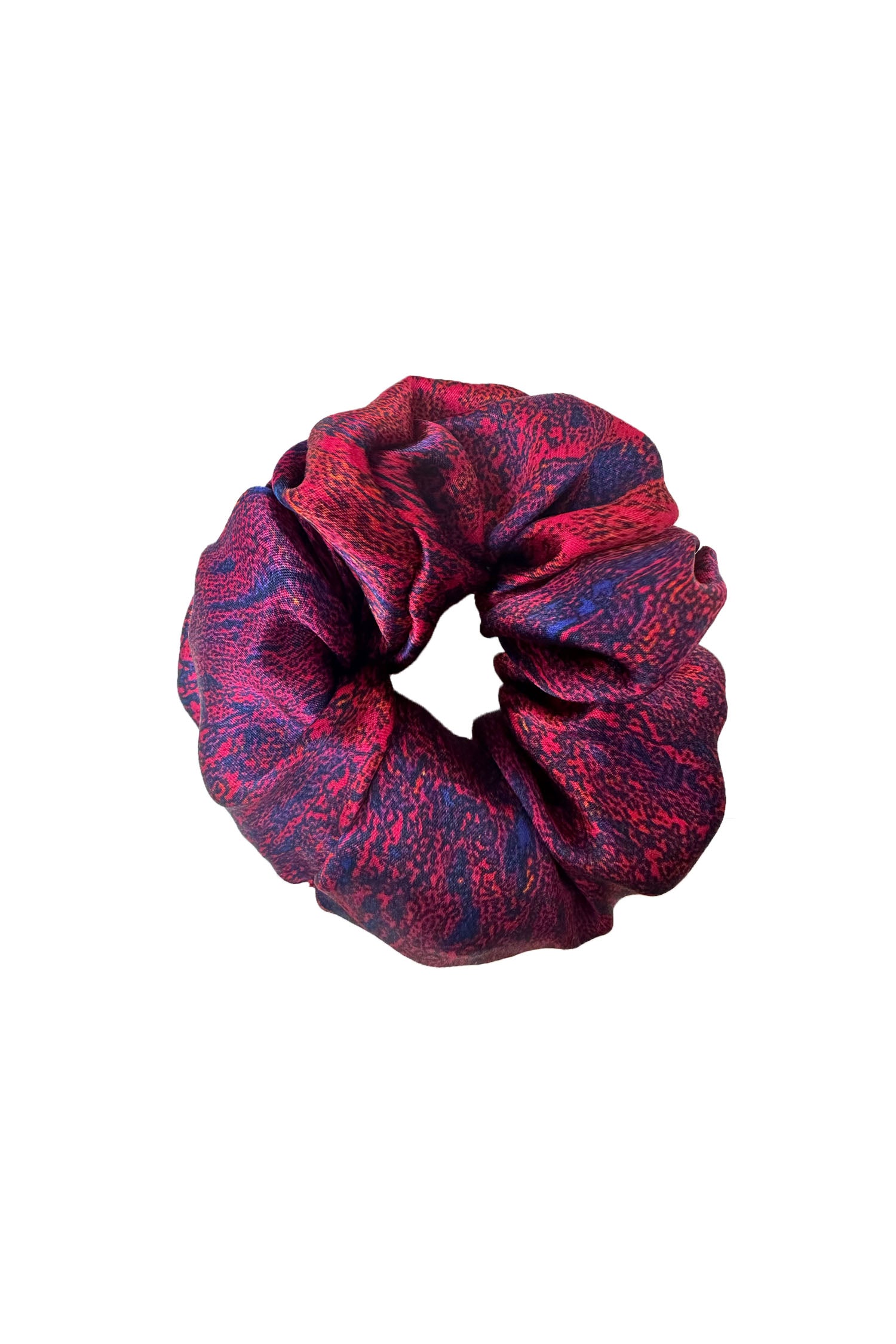 An Isabel Manns red marble print silk satin scrunchie.