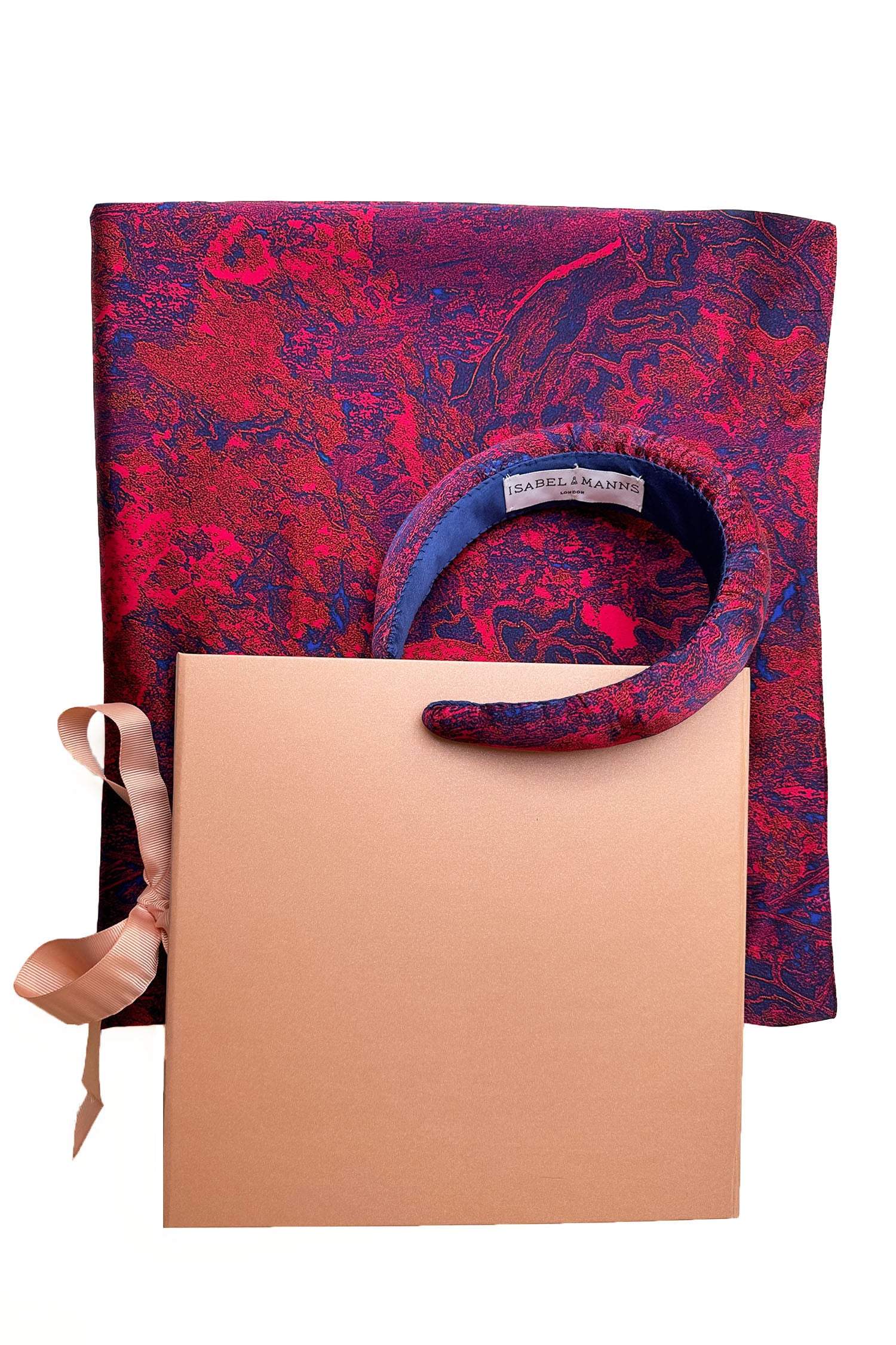 Long double-sided silk satin scarf in red marble print, with matching padded headband and large pink gift box bow tied ribbon.