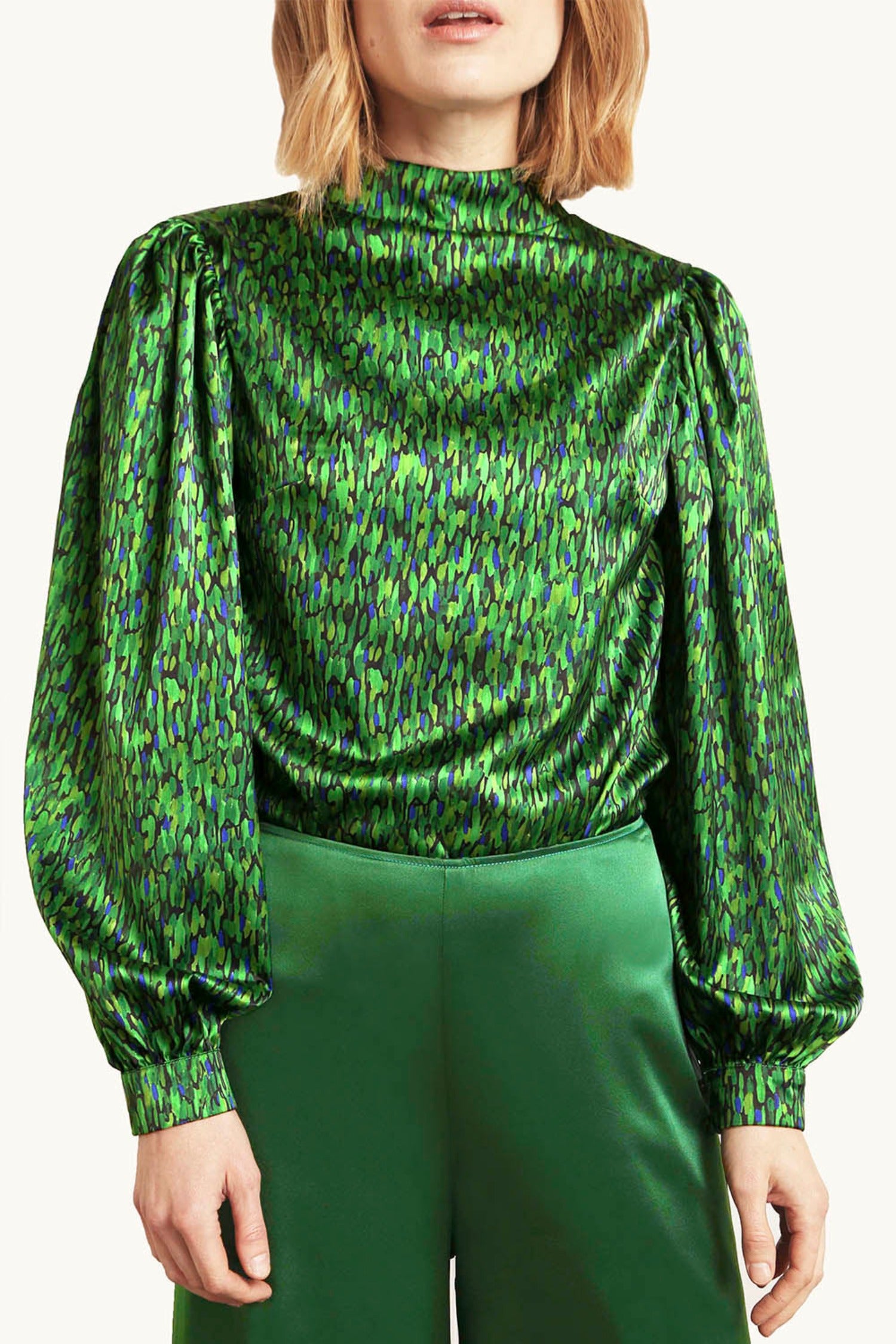 An Isabel Manns reversible long wide sleeve silk satin top with a collar tie in vibrant green print.