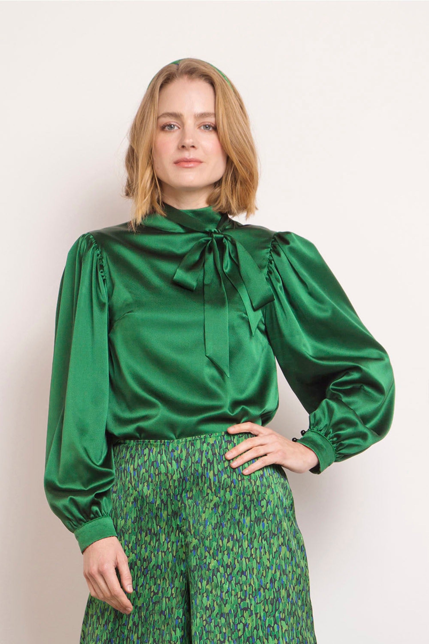 Reversible long wide sleeve silk satin top with a collar tie in emerald, front bow detail.