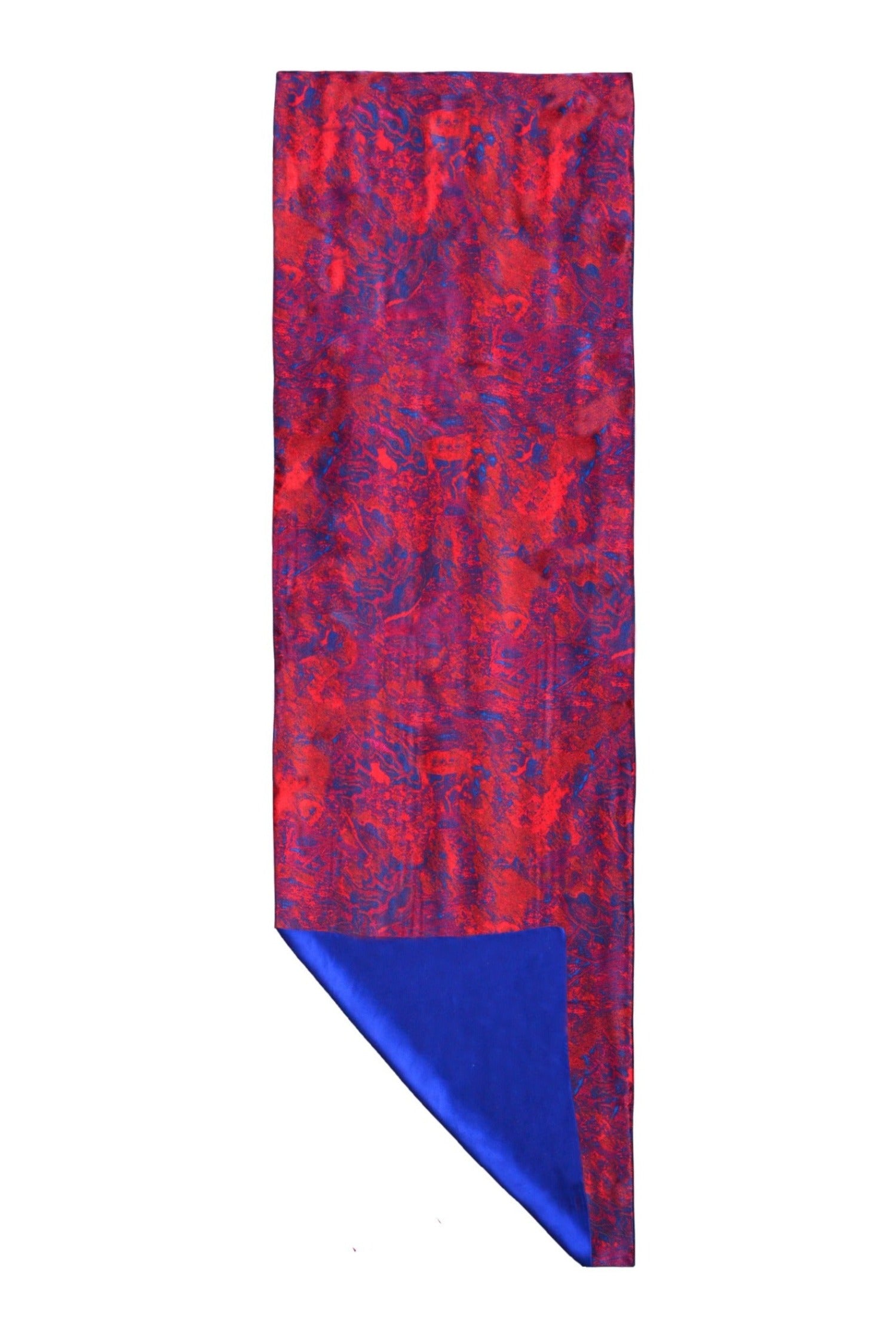 Long reversible silk satin scarf in red marble print and cobalt.