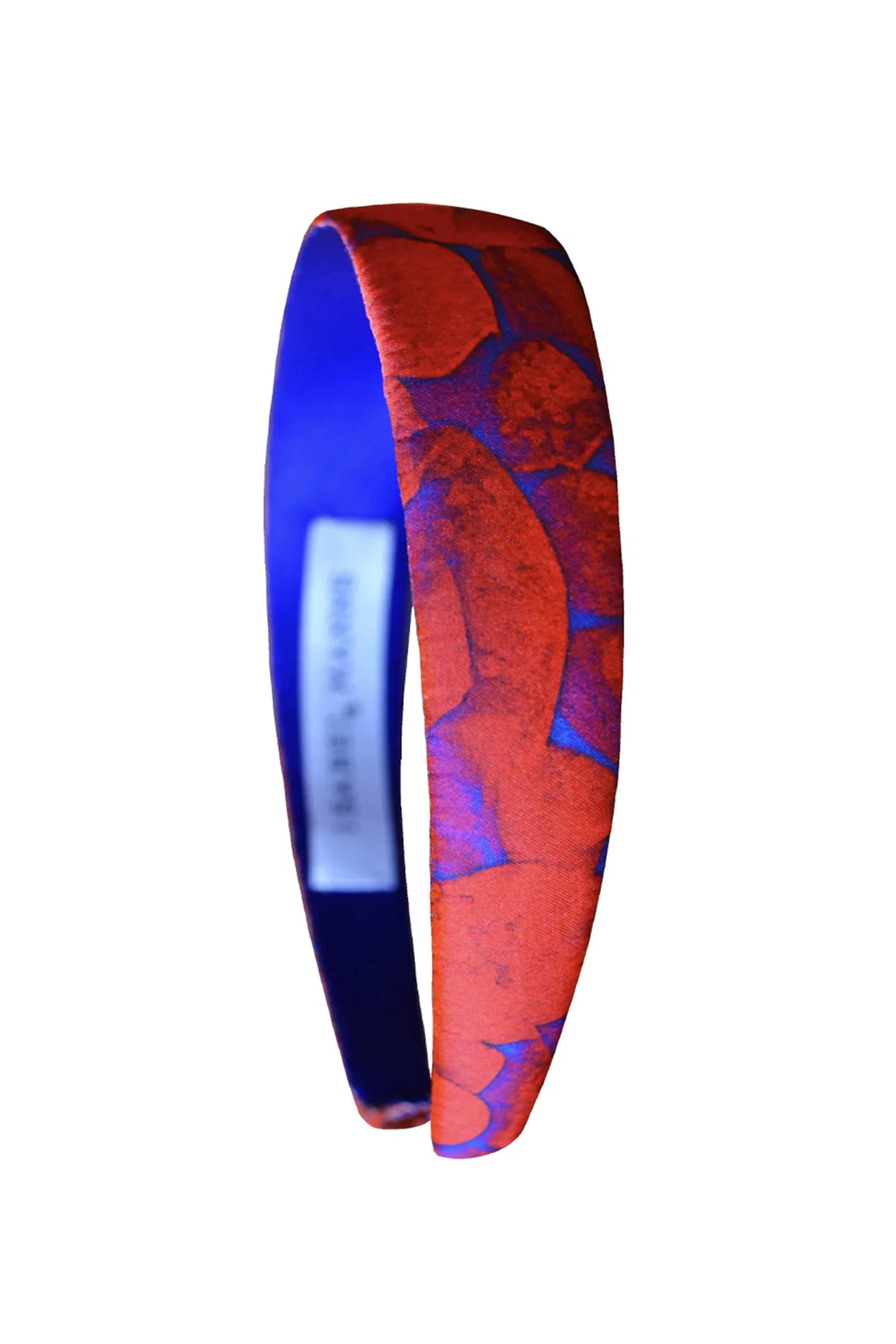 a red printed headband inspired by pebbles handmade in London