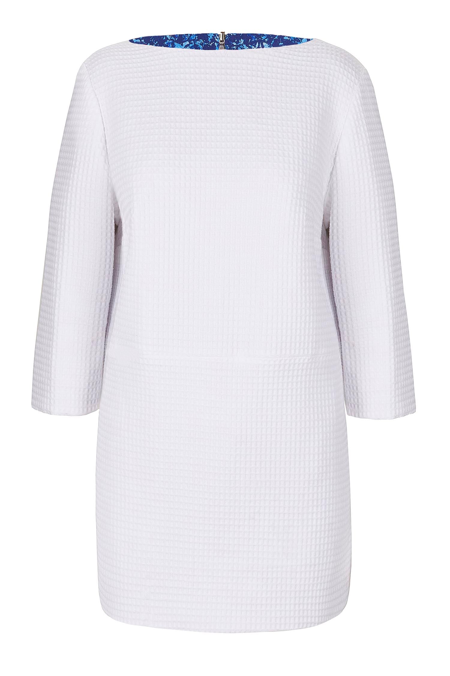Reversible tunic top with ¾ length sleeves in white.