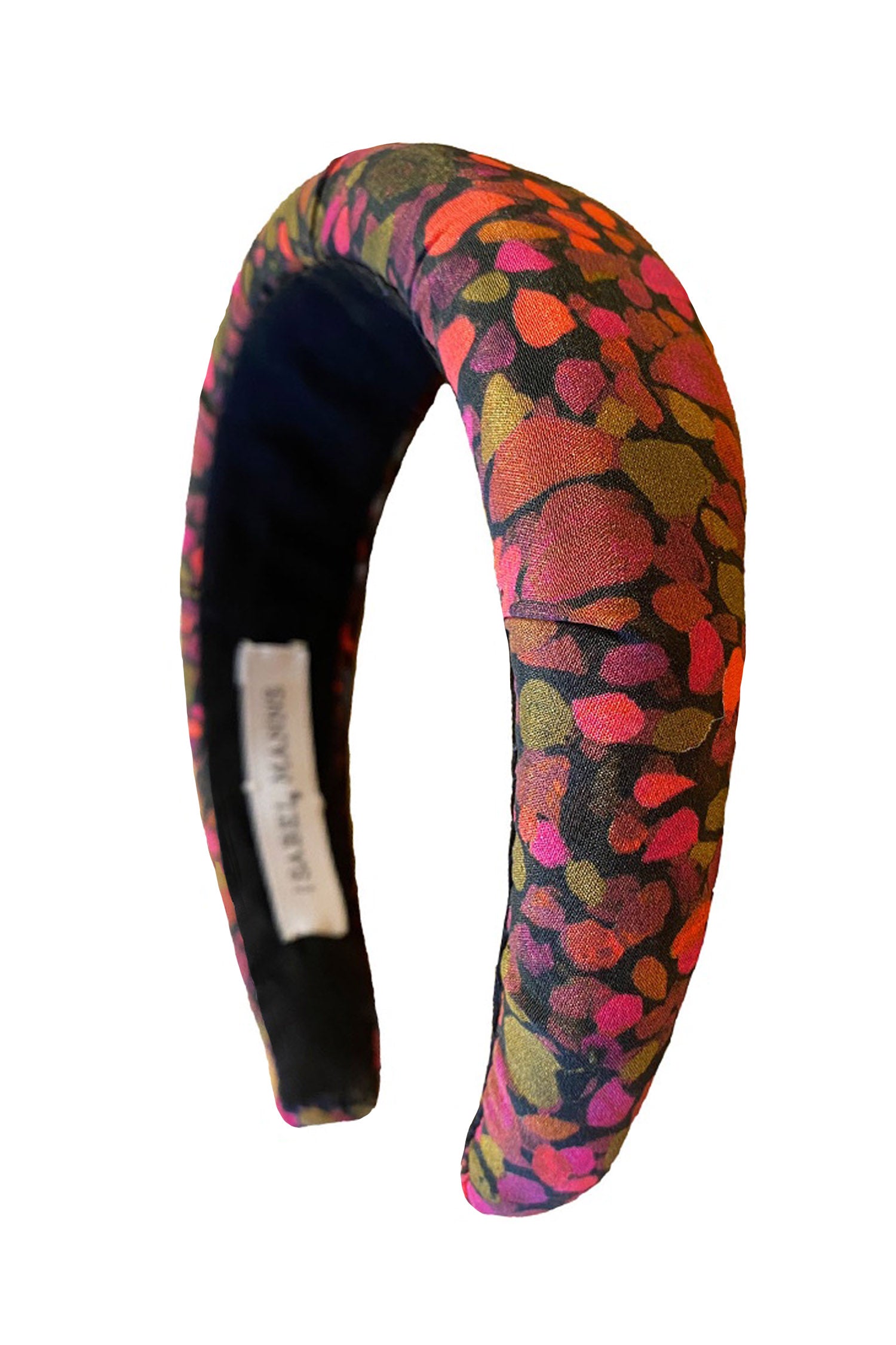 A silk padded headband in a unique brown and piink print