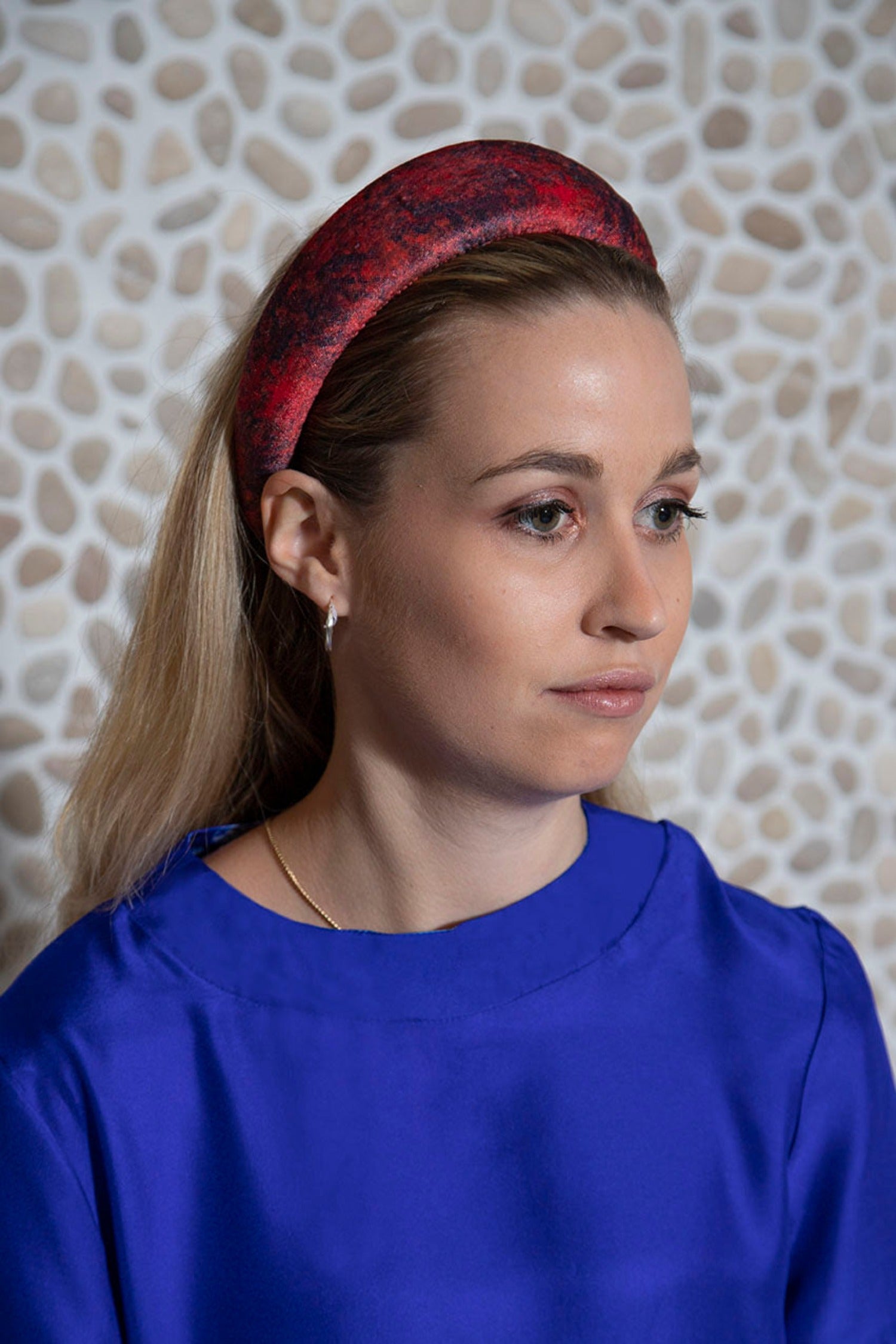 Velvet red printed padded headband worn by a model perfect for the festive season