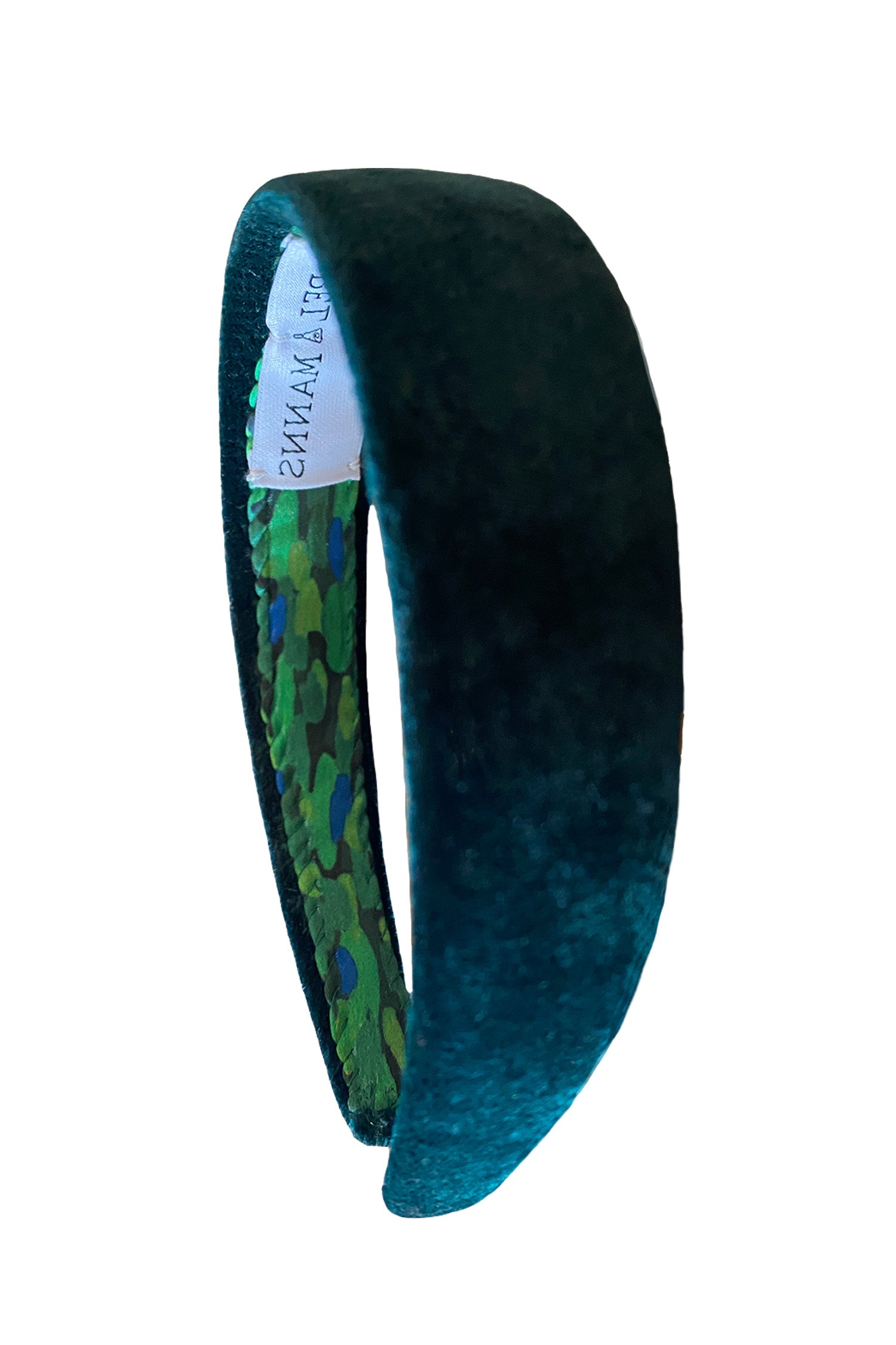 a luxurious dark green velvet headband that is great for the winter season
