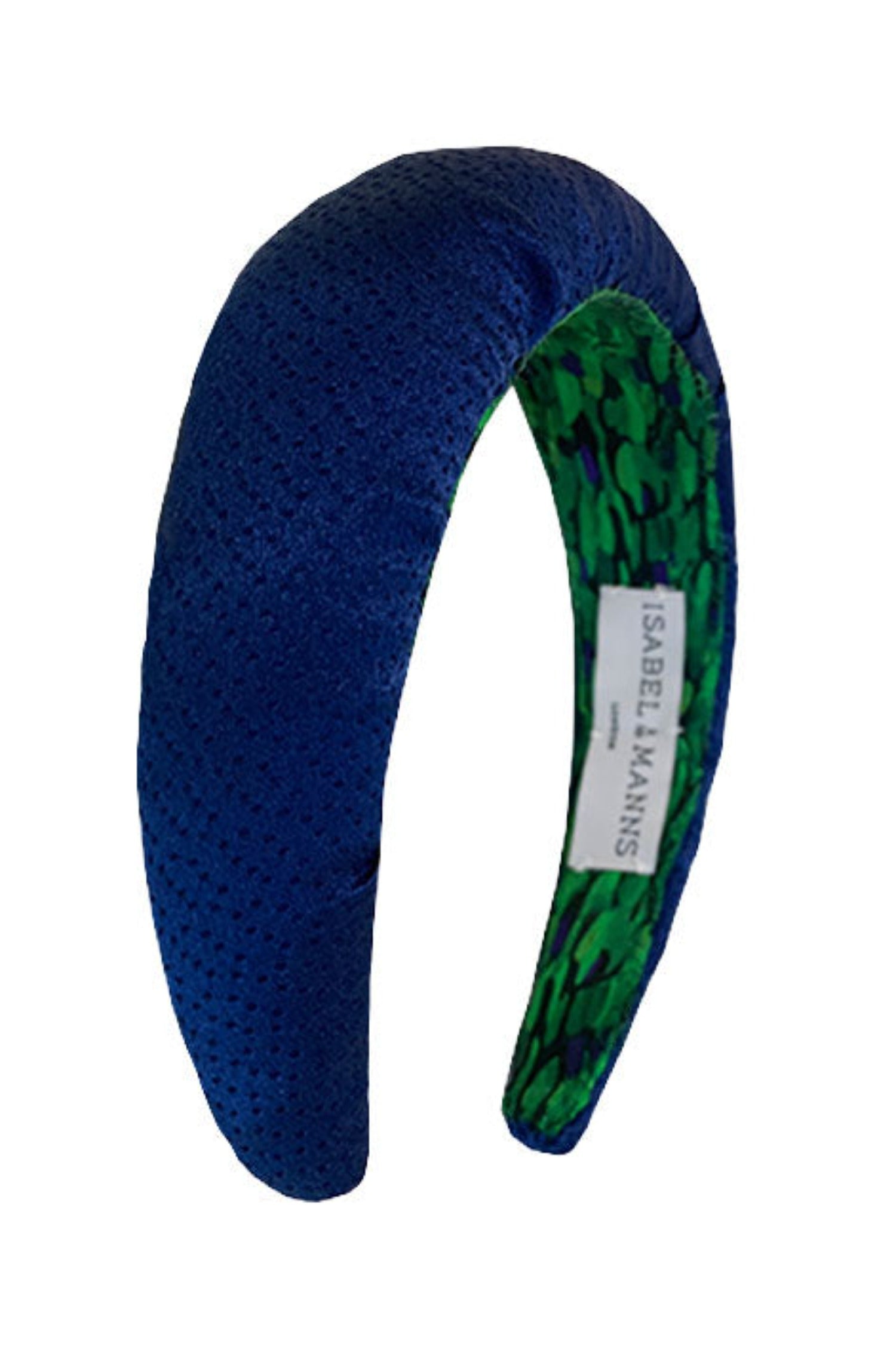 a classic navy padded headband that has a dotted texture to the fabric making it timeless and versatile