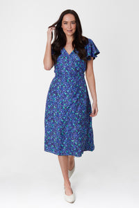 A silk bamboo blue floral printed wrap dress with short sleeves and midi length