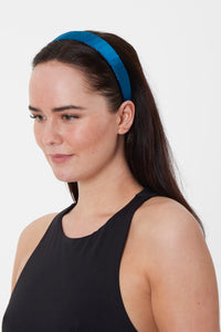 A unique but timeless teal silk satin headband sustainably made in the UK