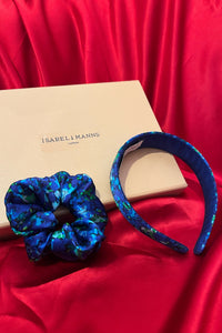 a matching gift box featuring a headband and scrunchie in a blue print