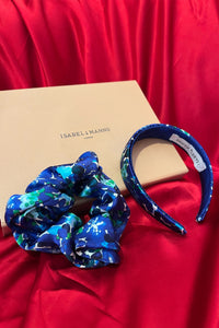 a blue printed headband and scrunchie in a gift box