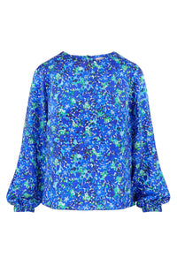 Long sleeve silk satin top with round neck in vibrant blue print.
