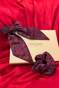 a gift box featuring a red printed silk hair bow clip and matching scrunchie