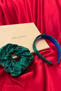 a gift box featuring a green printed silk scrunchie and headband