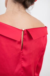 Pearl fastener detail back view of reversible boat neckline top with ¾ sleeves in raspberry pink.