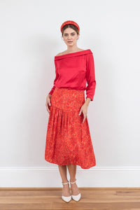 Reversible boat neckline top with ¾ sleeves in raspberry pink, worn with matching Lola Skirt Miami passion and padded headband.