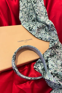 a gift box featuring a silk bamboo scarf and headband