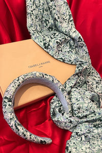 a pale green printed scarf and padded headband gift box
